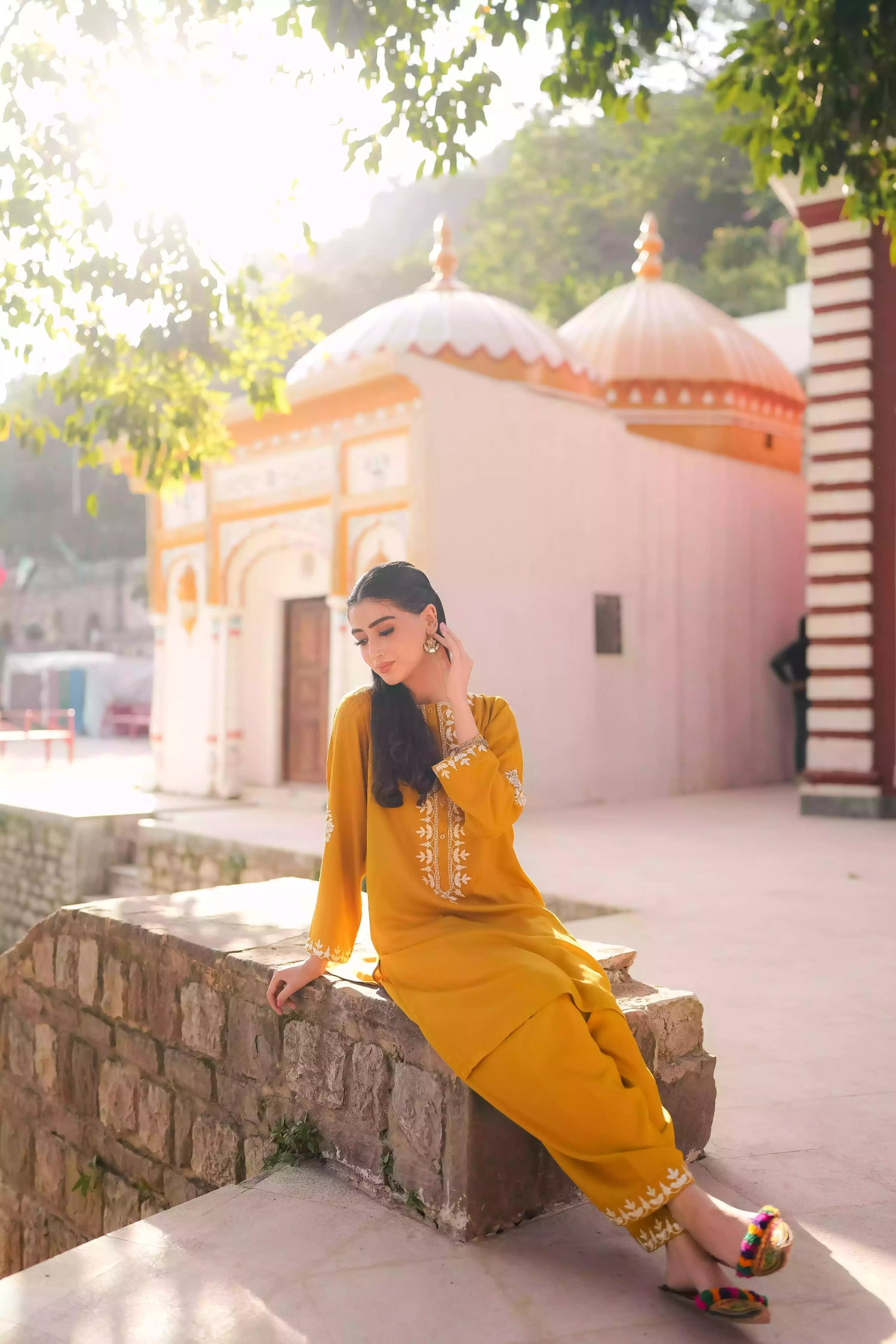 Mustard yellow embroidered kurta, featuring soft, flowing fabric with delicate white floral embroidery paired with a shalwar detailed with subtle threadwork. Styled for modern, festive, or daytime wear.
