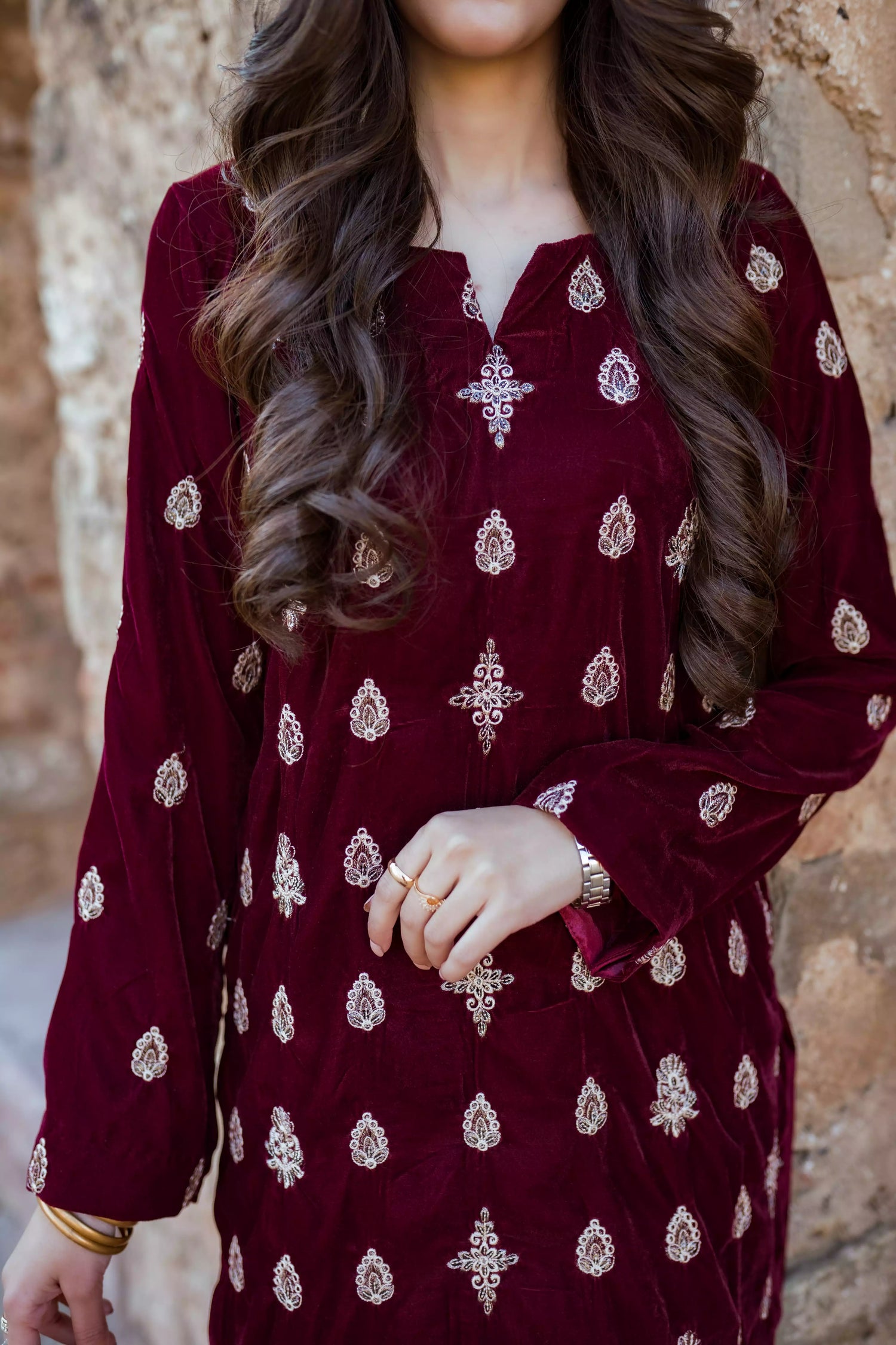 Traditional maroon velvet suit with embroidered details, complemented by a full embroidered shawl and chore paincha shalwar.