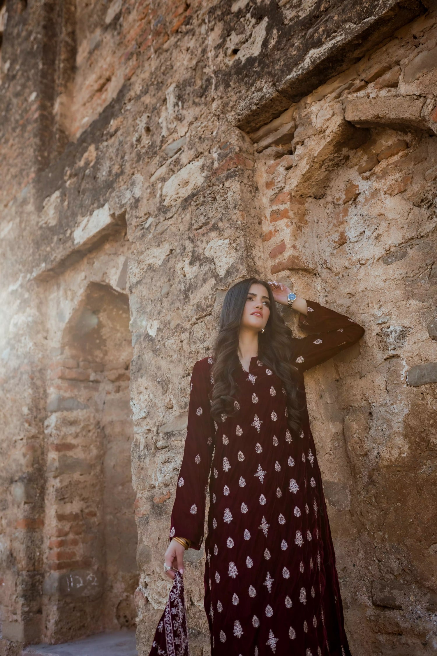 Traditional maroon velvet suit with embroidered details, complemented by a full embroidered shawl and chore paincha shalwar.