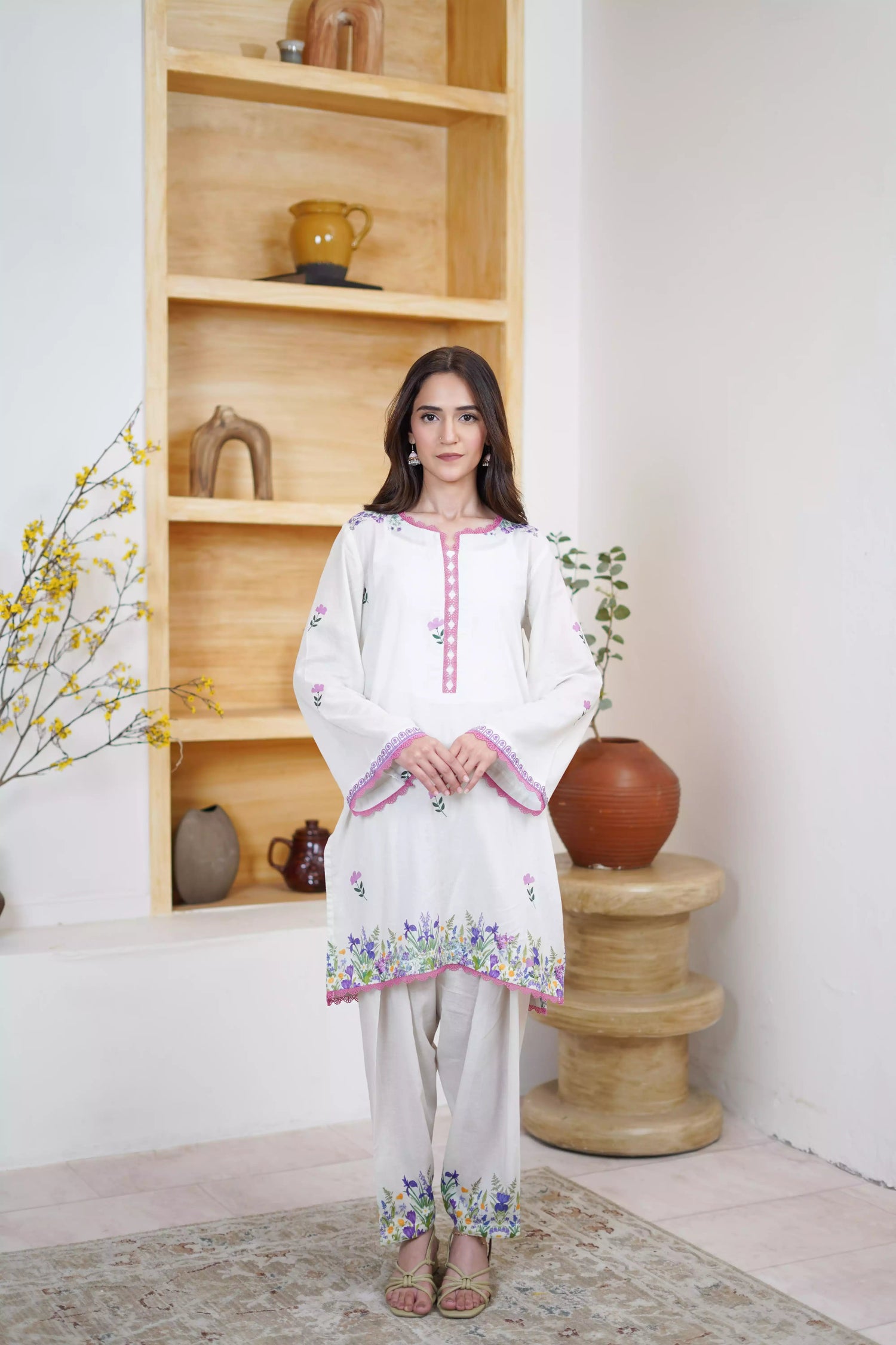 Cream Shalwar Kameez with delicate lavender and violet digital floral print, featuring scattered pastel blooms on breathable lawn. A graceful blend of modern charm.