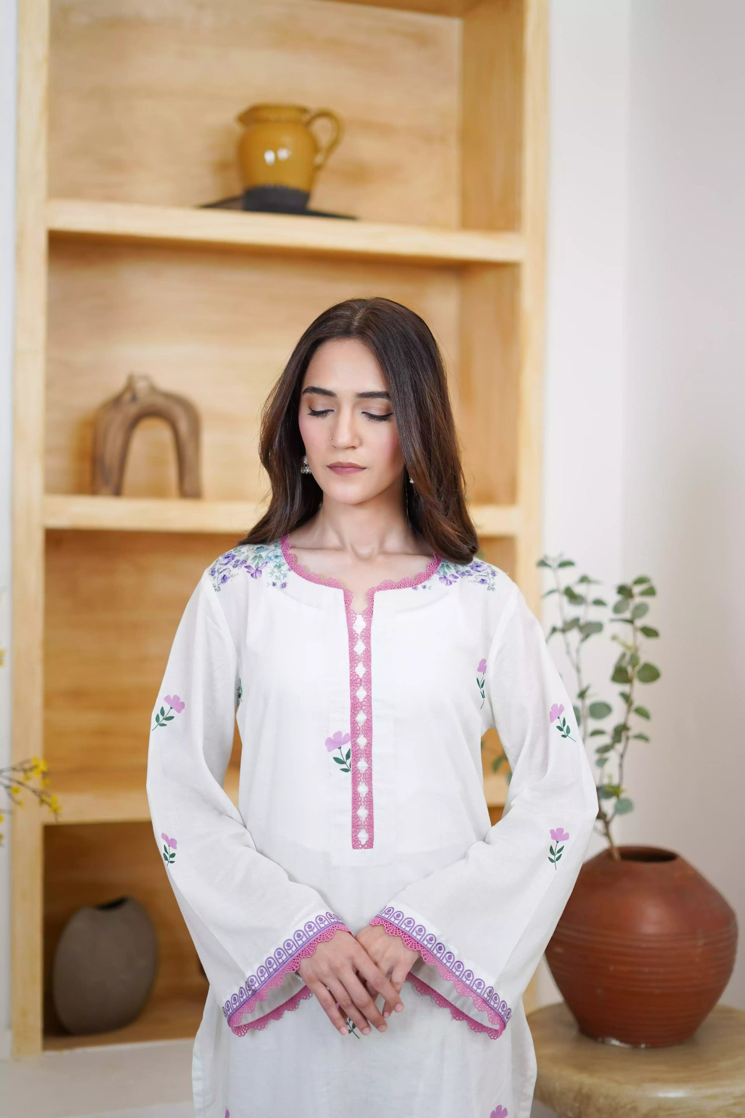 Cream Shalwar Kameez with delicate lavender and violet digital floral print, featuring scattered pastel blooms on breathable lawn. A graceful blend of modern charm.