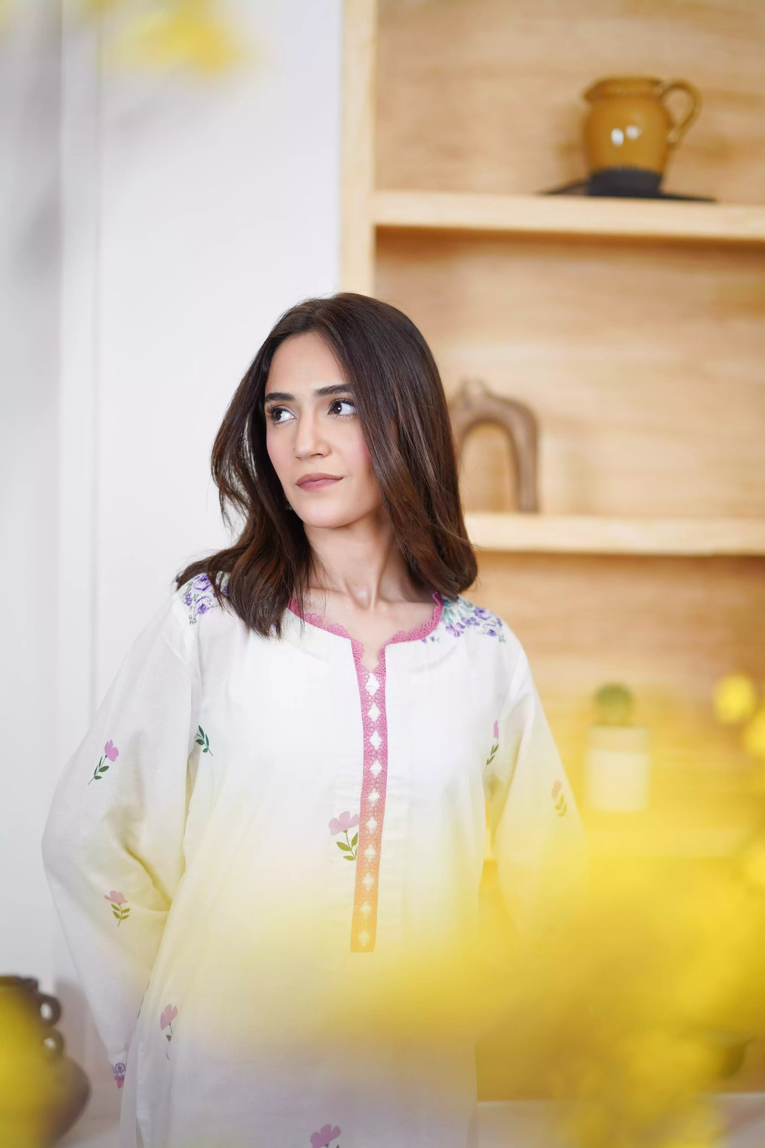 Cream Shalwar Kameez with delicate lavender and violet digital floral print, featuring scattered pastel blooms on breathable lawn. A graceful blend of modern charm.