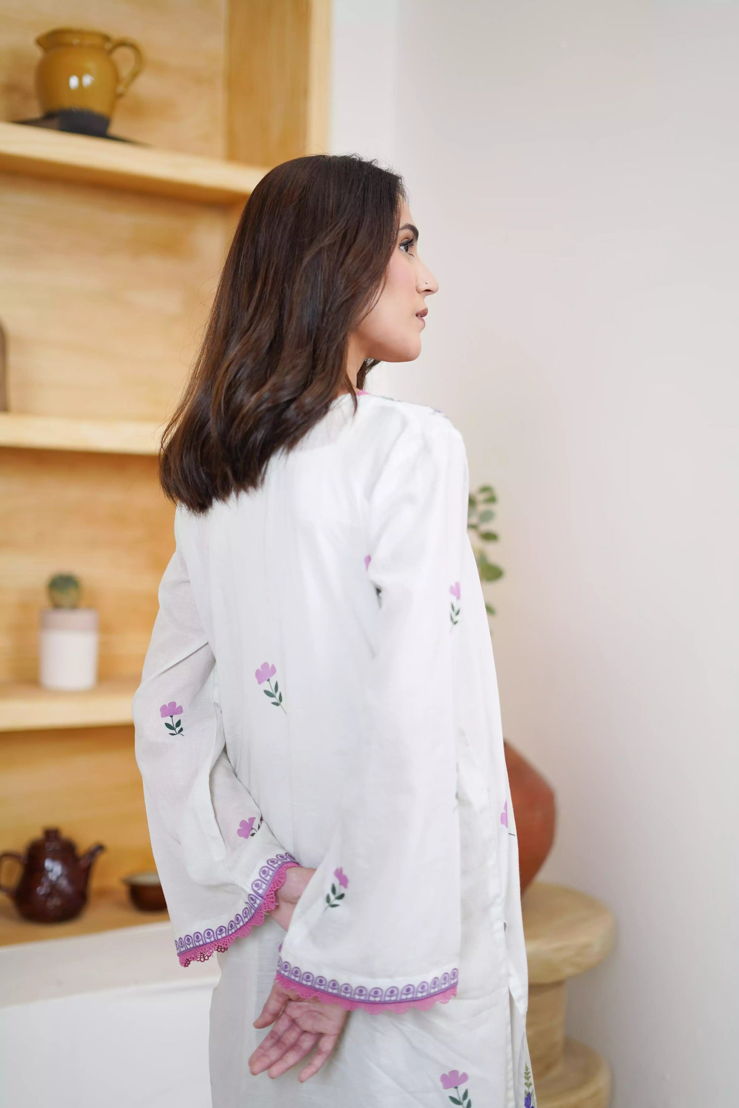 Cream Shalwar Kameez with delicate lavender and violet digital floral print, featuring scattered pastel blooms on breathable lawn. A graceful blend of modern charm.