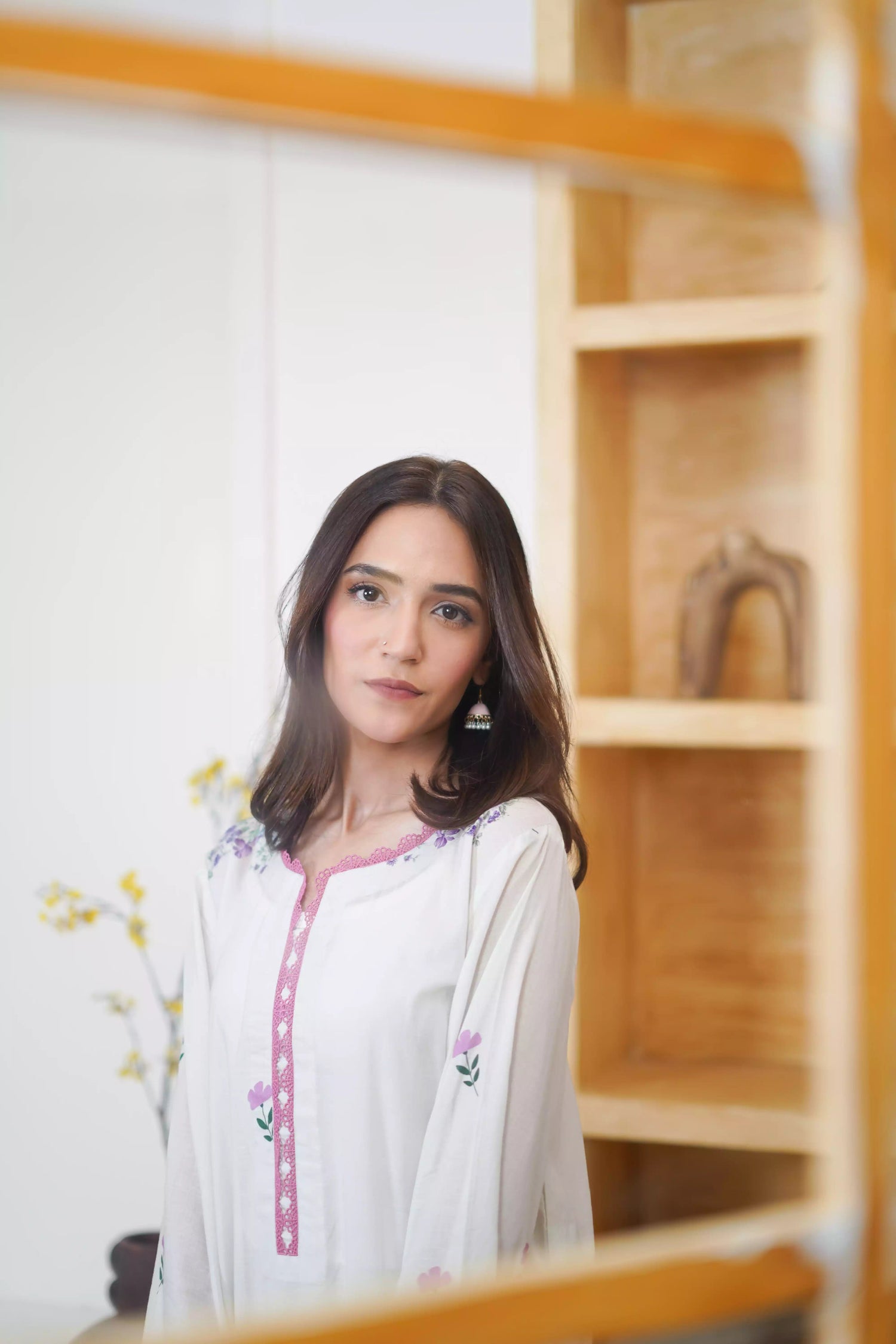Cream Shalwar Kameez with delicate lavender and violet digital floral print, featuring scattered pastel blooms on breathable lawn. A graceful blend of modern charm.
