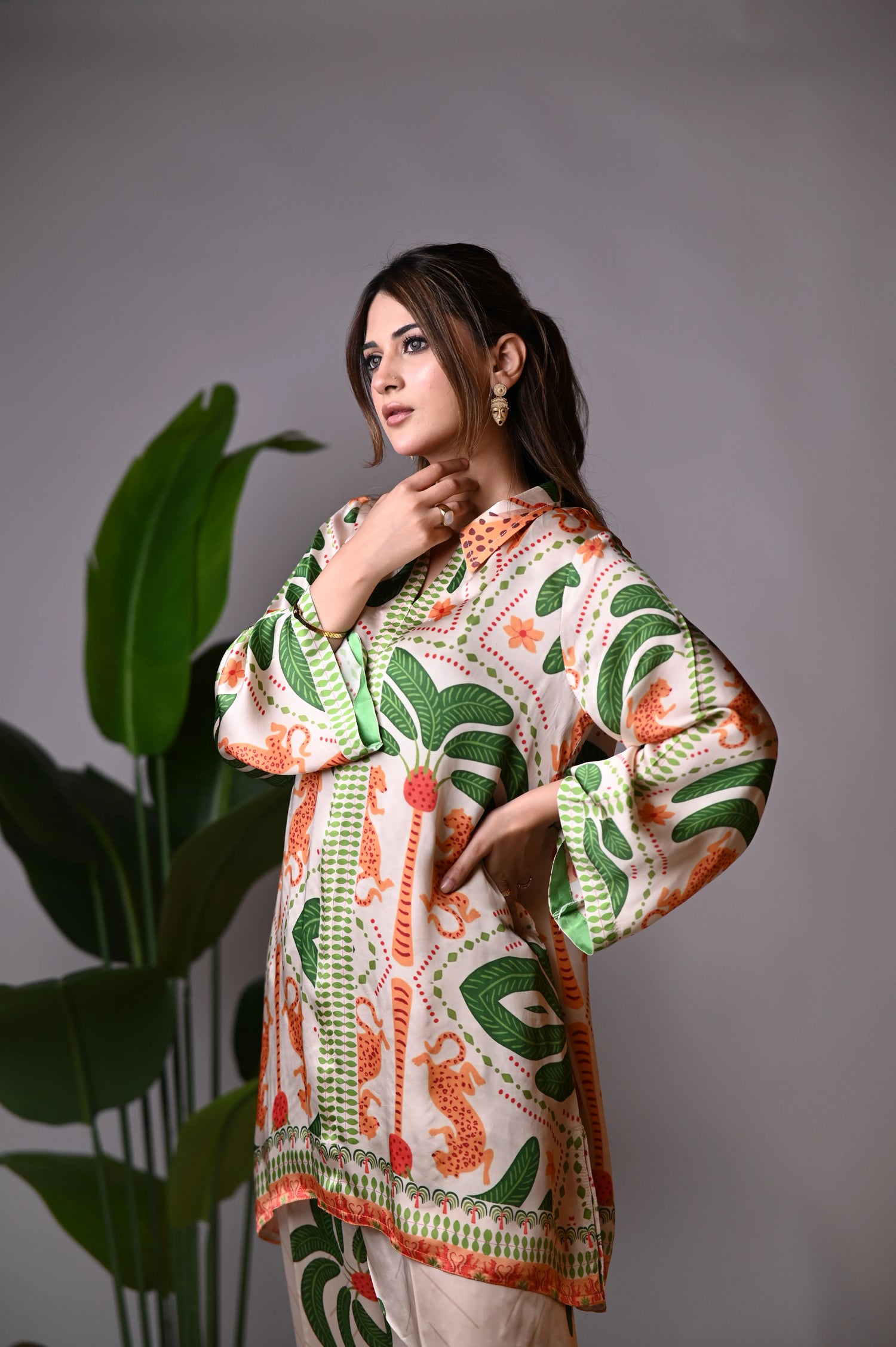 An elegant jungle-themed ensemble crafted from breathable summer silk, showcasing intricate floral patterns, towering palm motifs, and majestic tiger illustrations offering a blend of exotic elegance and comfort.