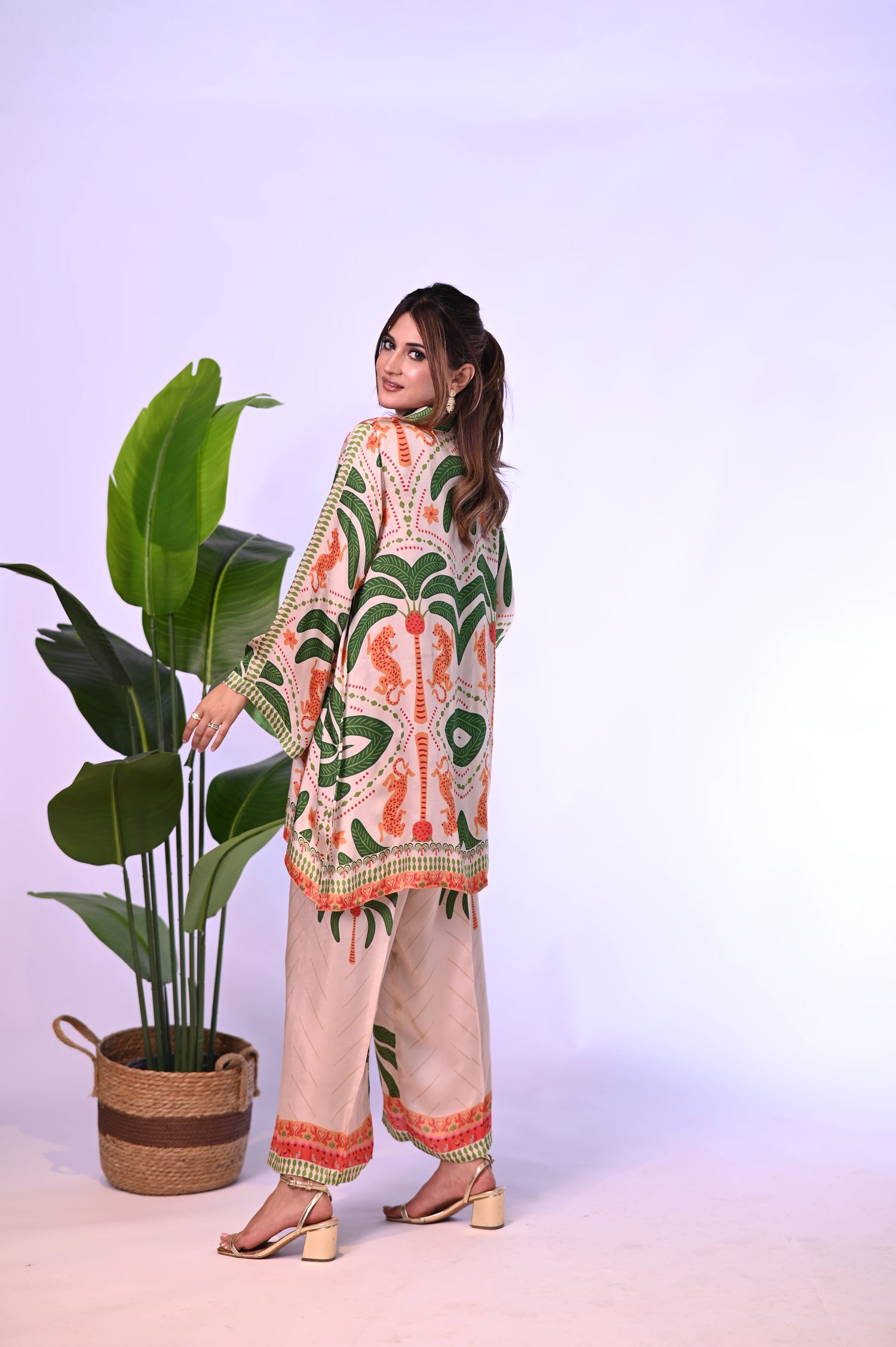 An elegant jungle-themed ensemble crafted from breathable summer silk, showcasing intricate floral patterns, towering palm motifs, and majestic tiger illustrations offering a blend of exotic elegance and comfort.
