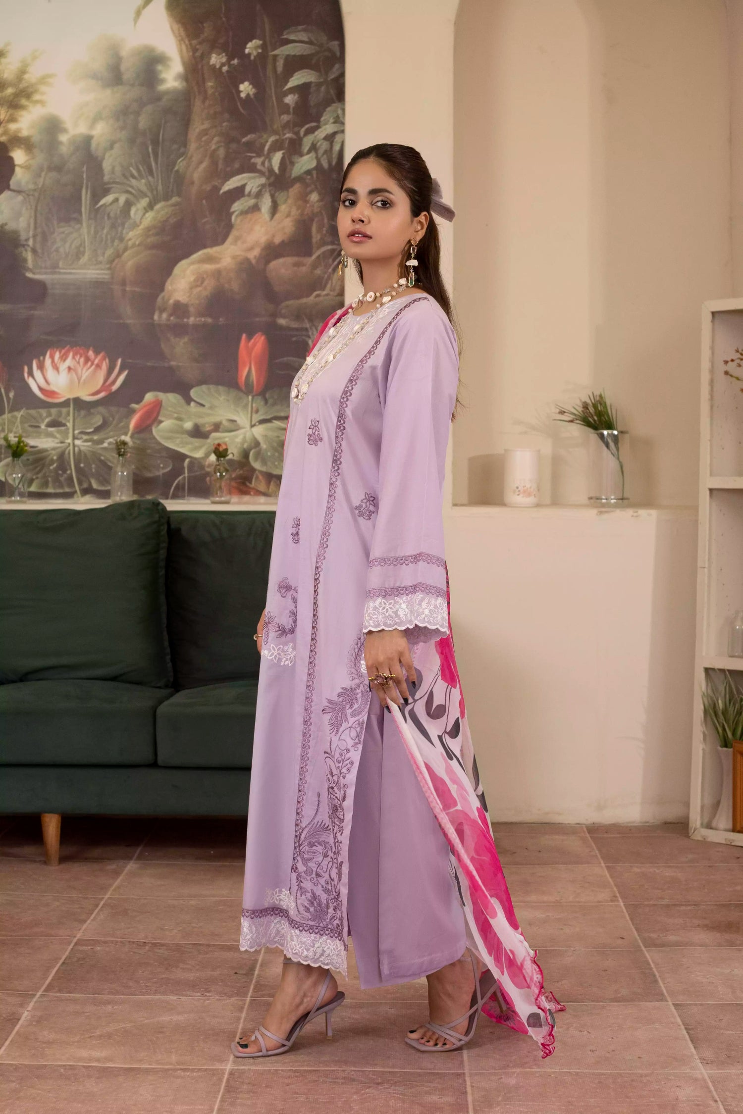 Elegant lilac suit with white embroidery, complemented by a pink rose-printed silk dupatta for a festive look.