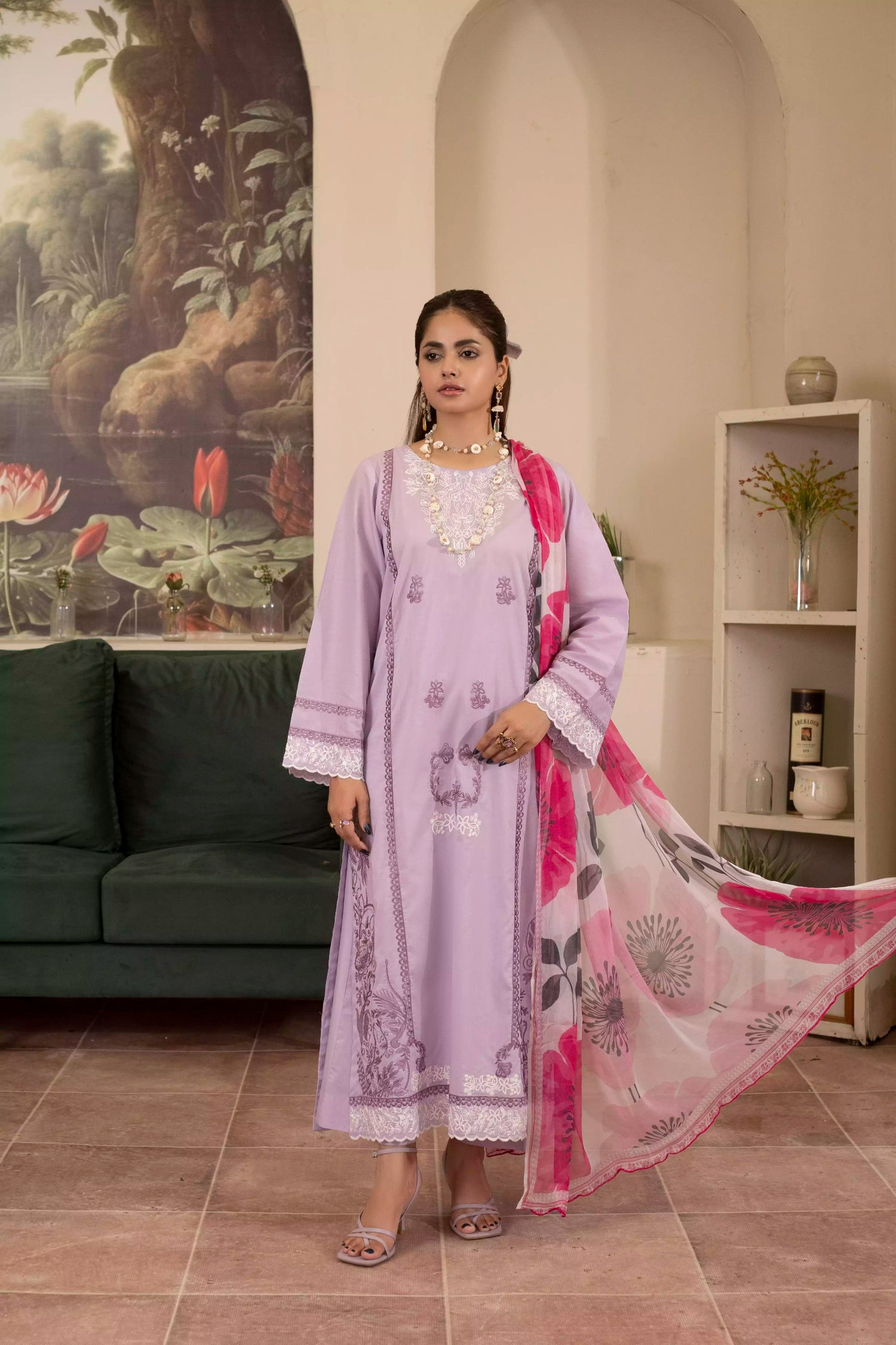 Elegant lilac suit with white embroidery, complemented by a pink rose-printed silk dupatta for a festive look.