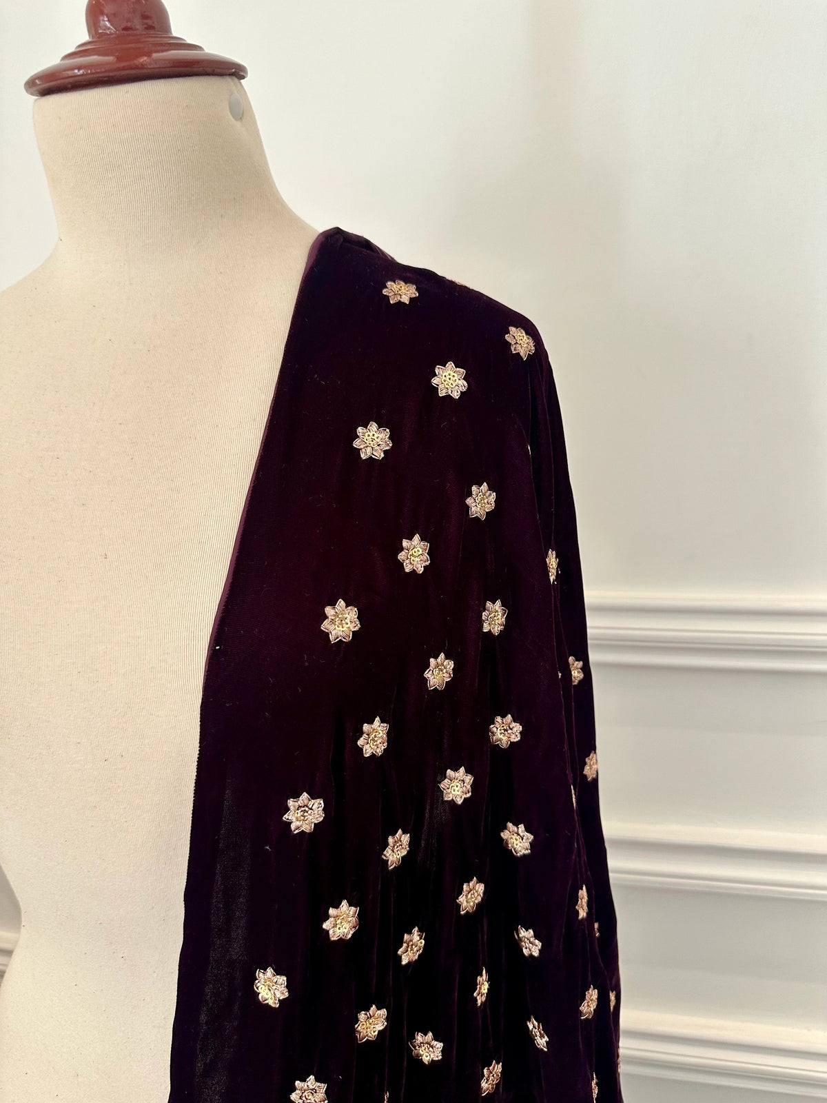 Luxurious lilac velvet shawl with intricate tila and sequin embroidery, draped elegantly, perfect for evening wear or special occasions.