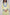 A pastel yellow suit adorned with delicate blue flowers and soft green leaves. The design features a border elegance and freshness.