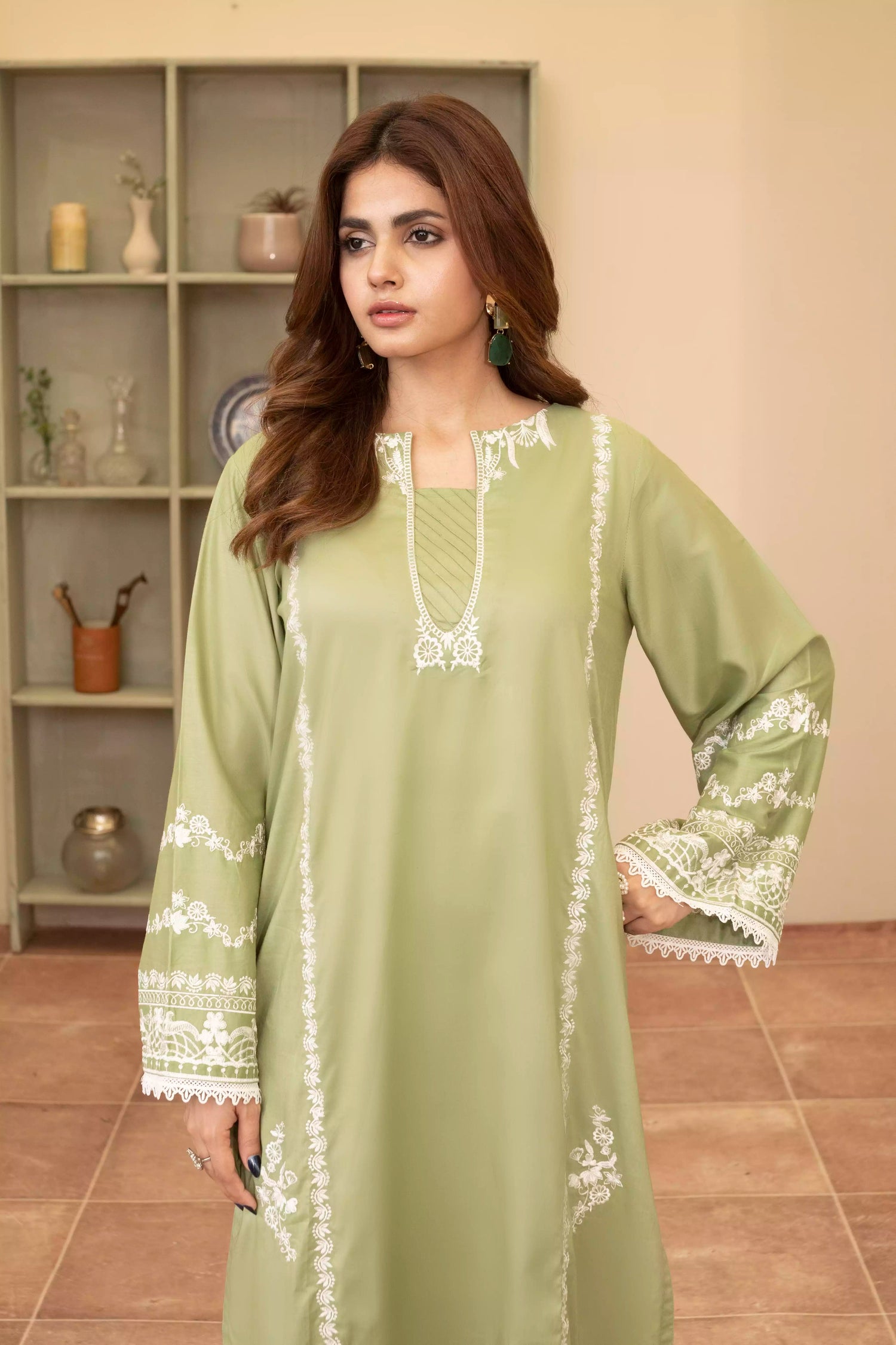 Elegant green embroidered suit with a straight-cut shirt and a breezy green dupatta, perfect for summer occasions.