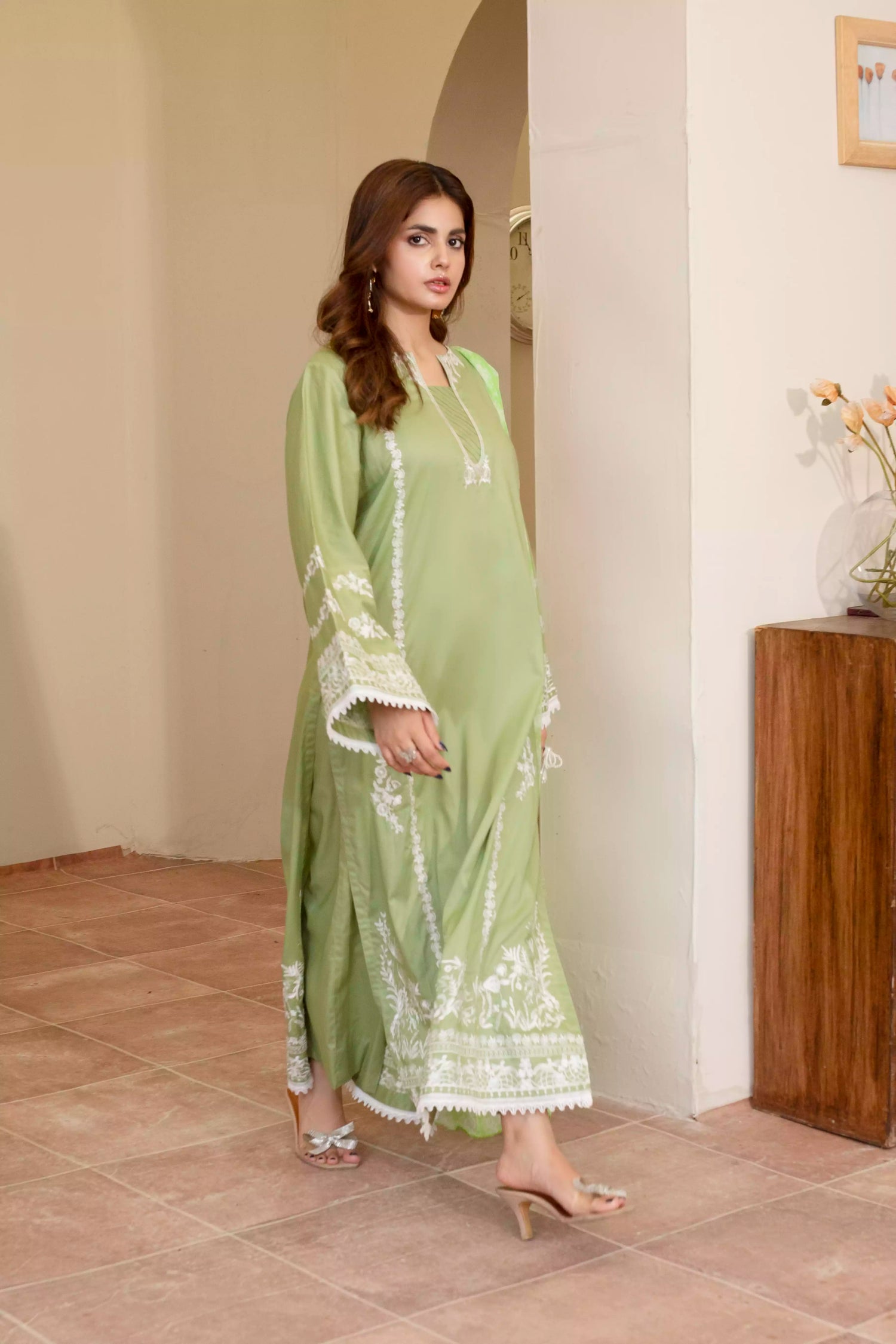 Elegant green embroidered suit with a straight-cut shirt and a breezy green dupatta, perfect for summer occasions.