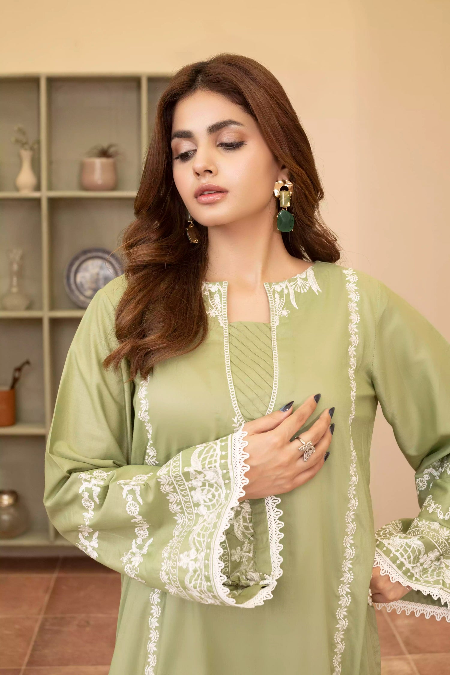 Elegant green embroidered suit with a straight-cut shirt and a breezy green dupatta, perfect for summer occasions.