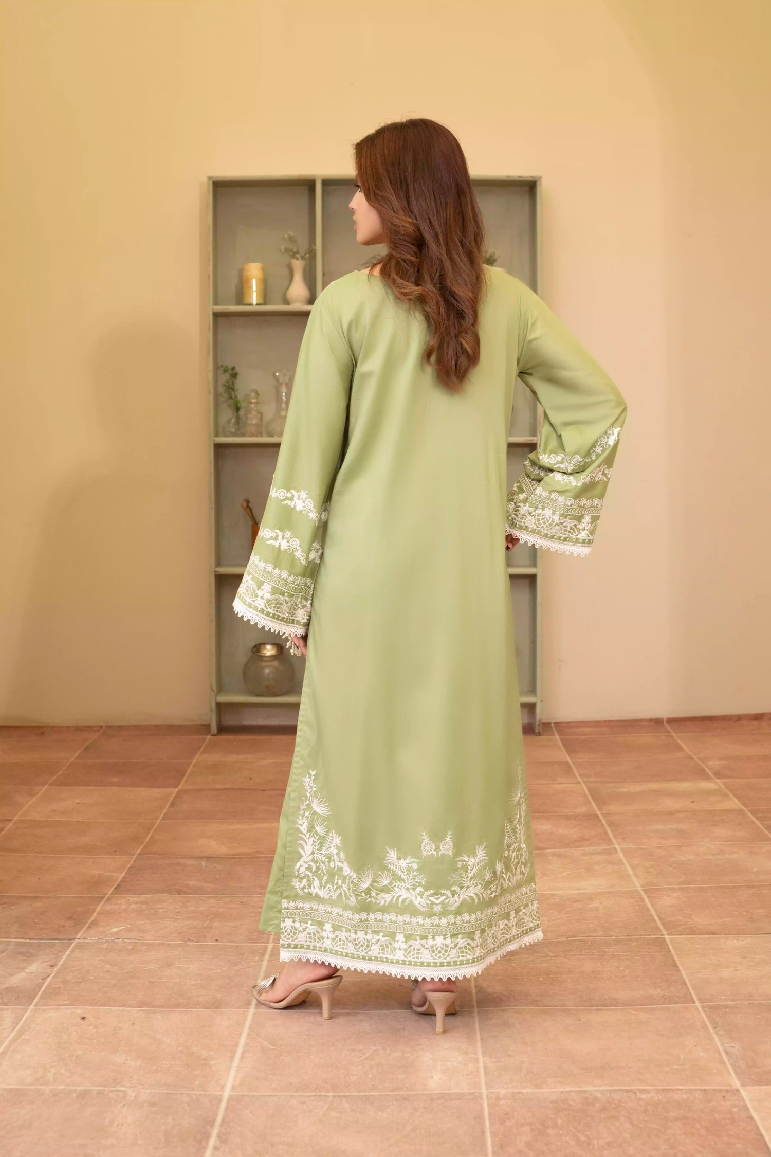 Elegant green embroidered suit with a straight-cut shirt and a breezy green dupatta, perfect for summer occasions.