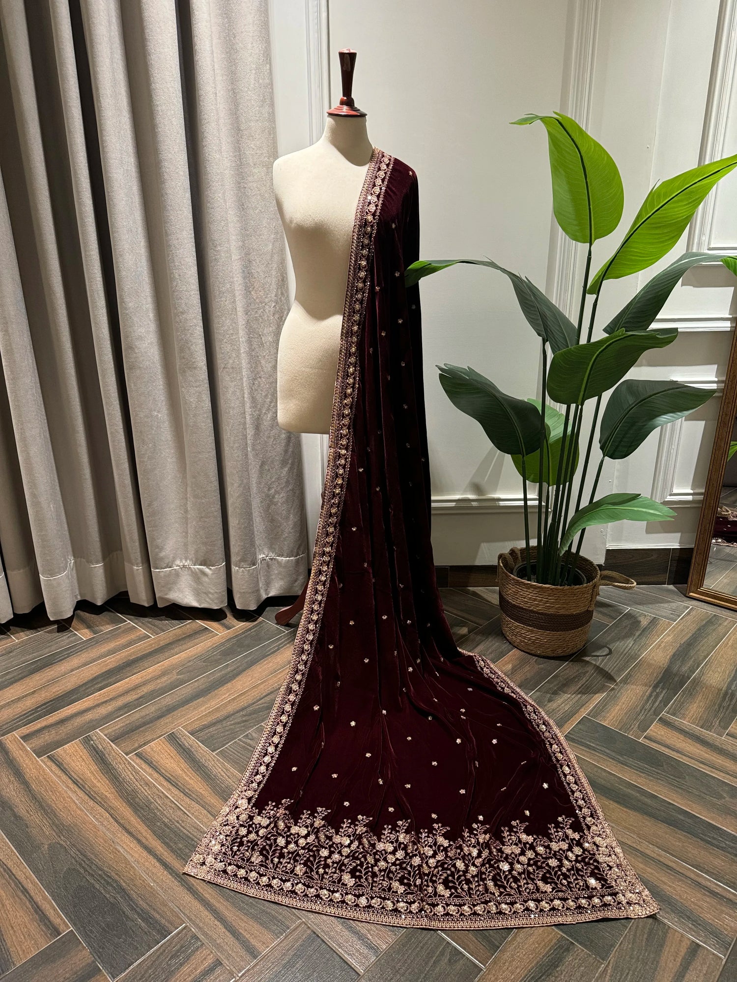 Maroon embroidered velvet shawl features traditional tilla floral work, with delicate motifs ideal for festive look.
