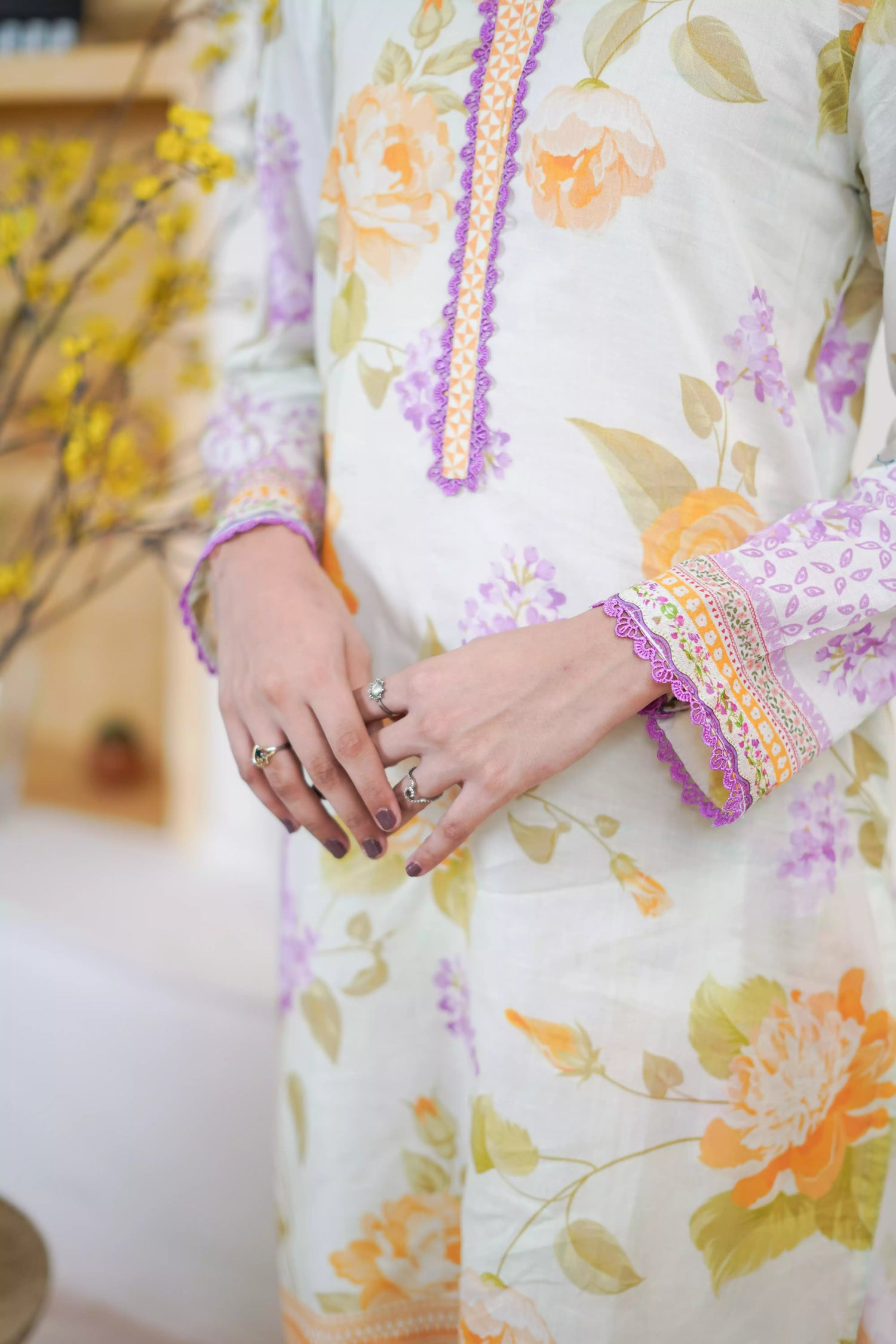 Lightweight kurta adorned with yellow and lilac flowers, capturing the essence of summer's blooming gardens.