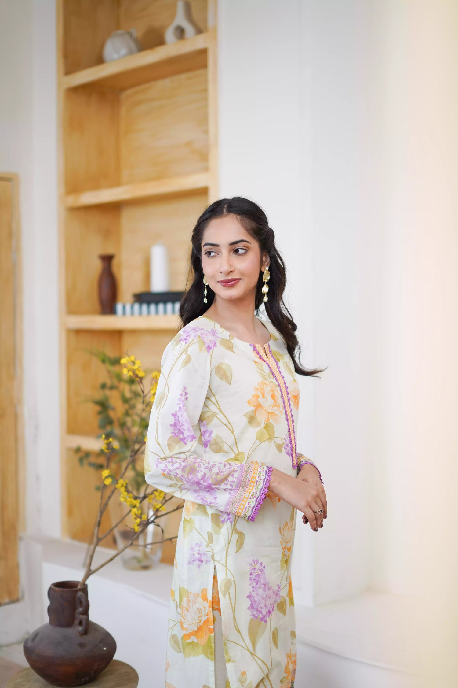 Lightweight kurta adorned with yellow and lilac flowers, capturing the essence of summer's blooming gardens.