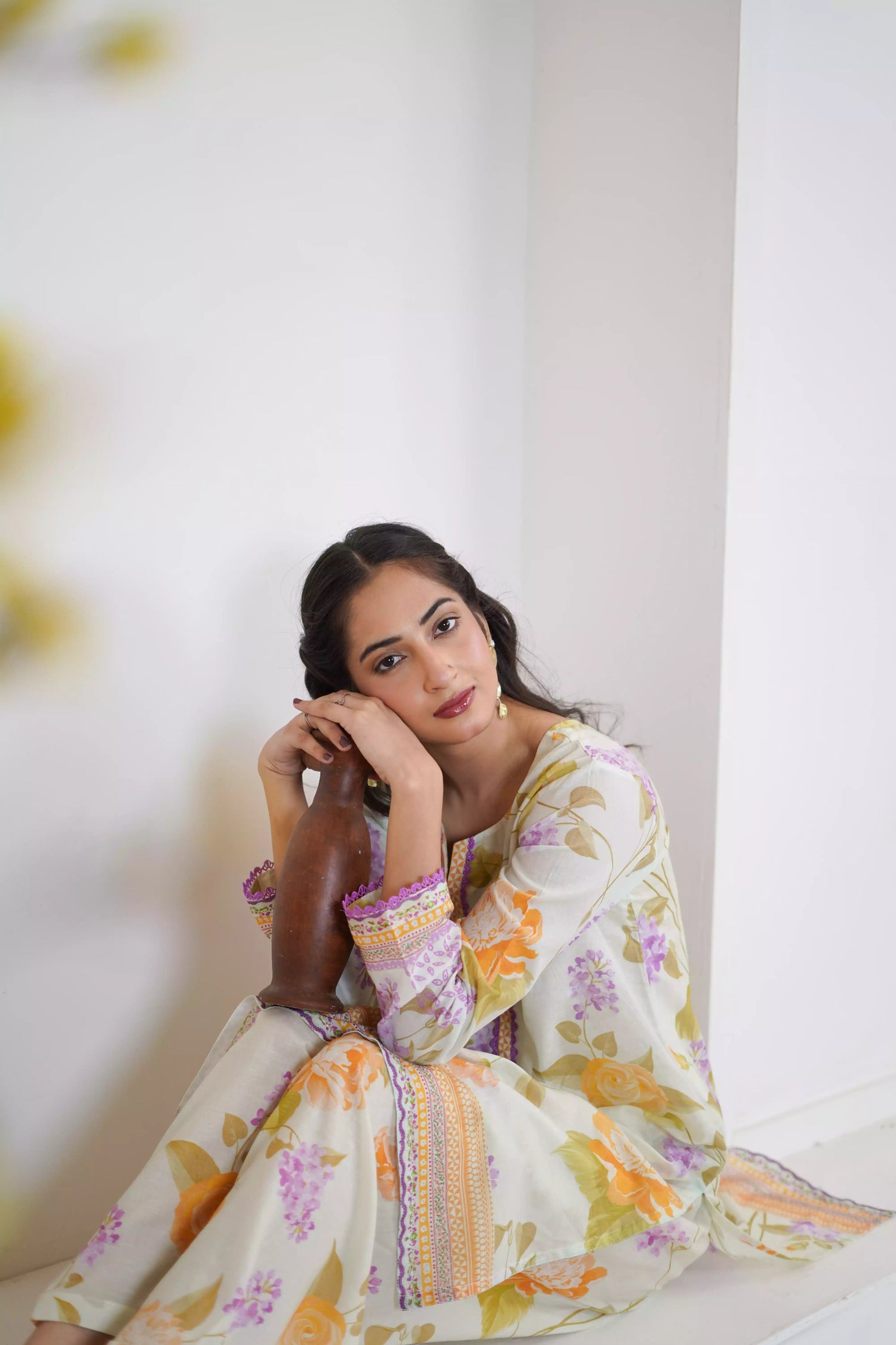 Lightweight kurta adorned with yellow and lilac flowers, capturing the essence of summer's blooming gardens.