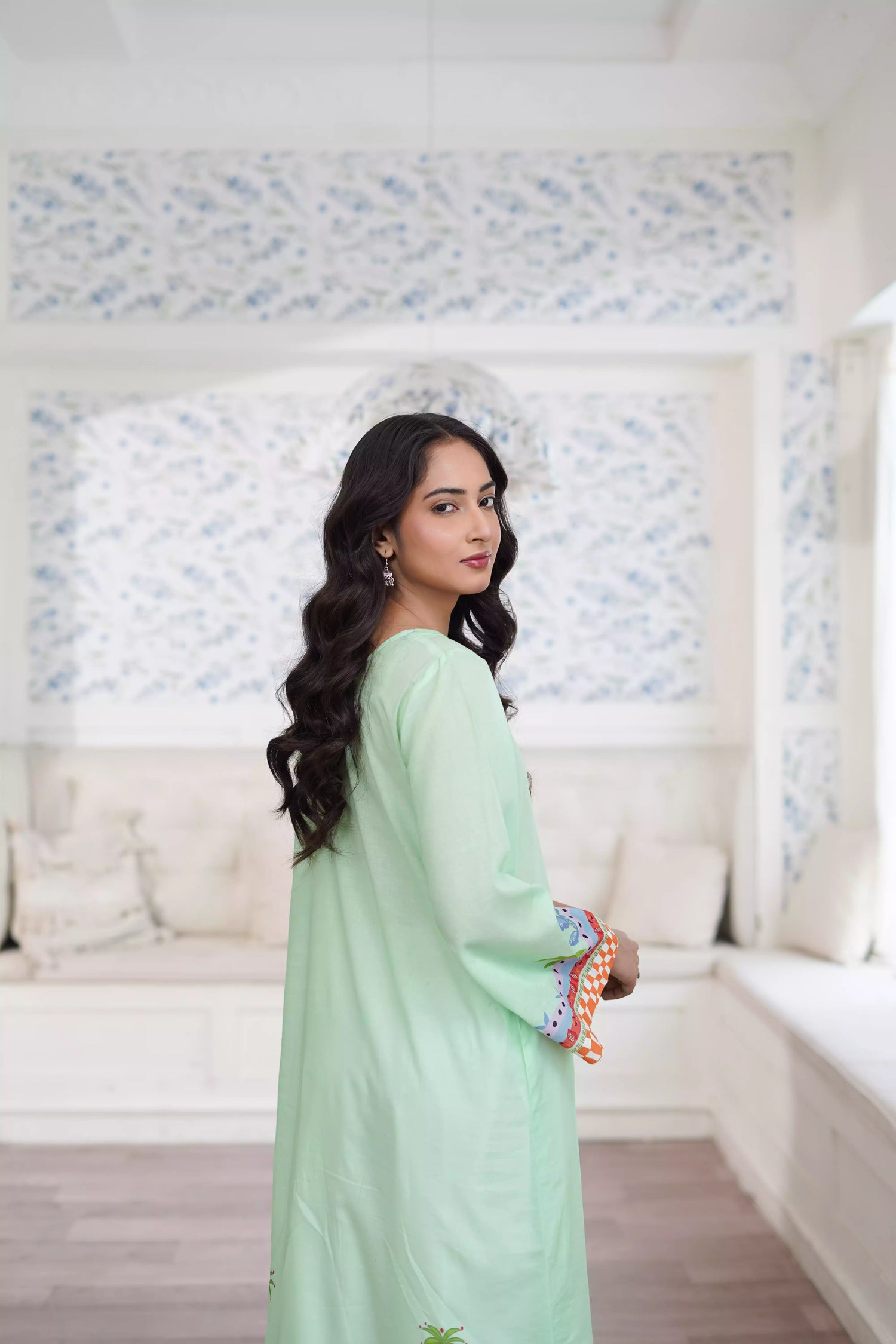 Elegant green kurta suit with beautiful nature inspired print, perfect for adding a touch of sophistication to any outfit.