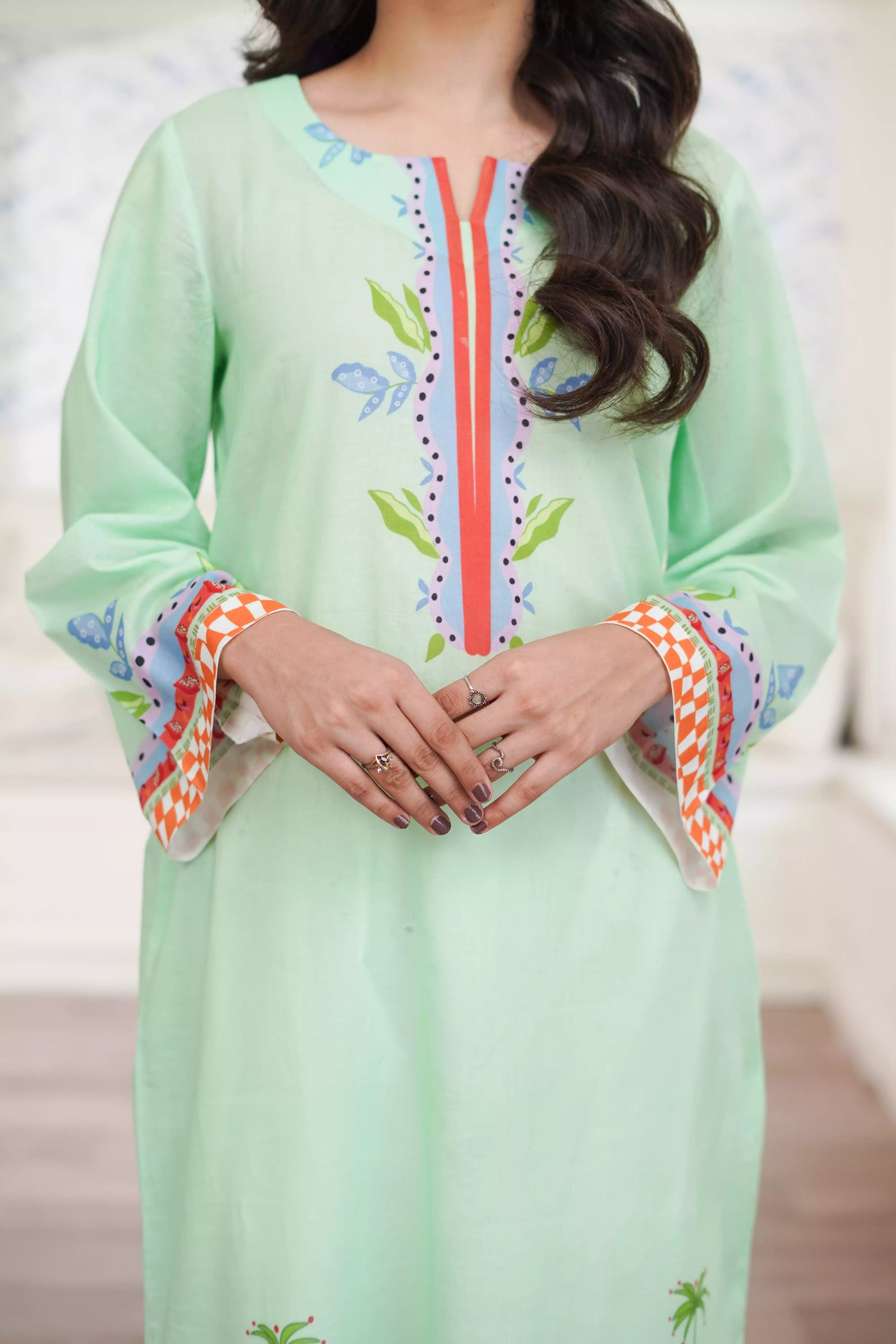 Elegant green kurta suit with beautiful nature inspired print, perfect for adding a touch of sophistication to any outfit.