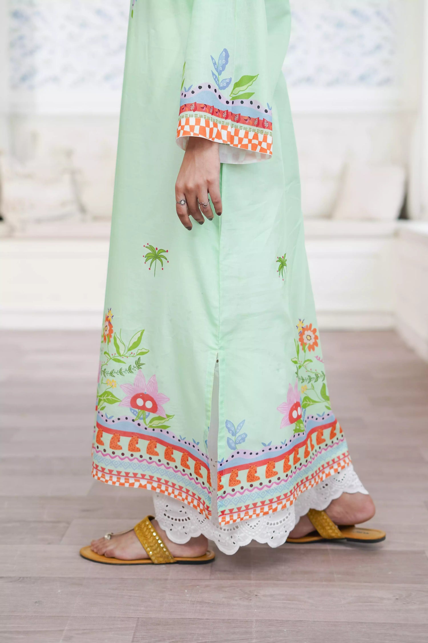 Elegant green kurta suit with beautiful nature inspired print, perfect for adding a touch of sophistication to any outfit.
