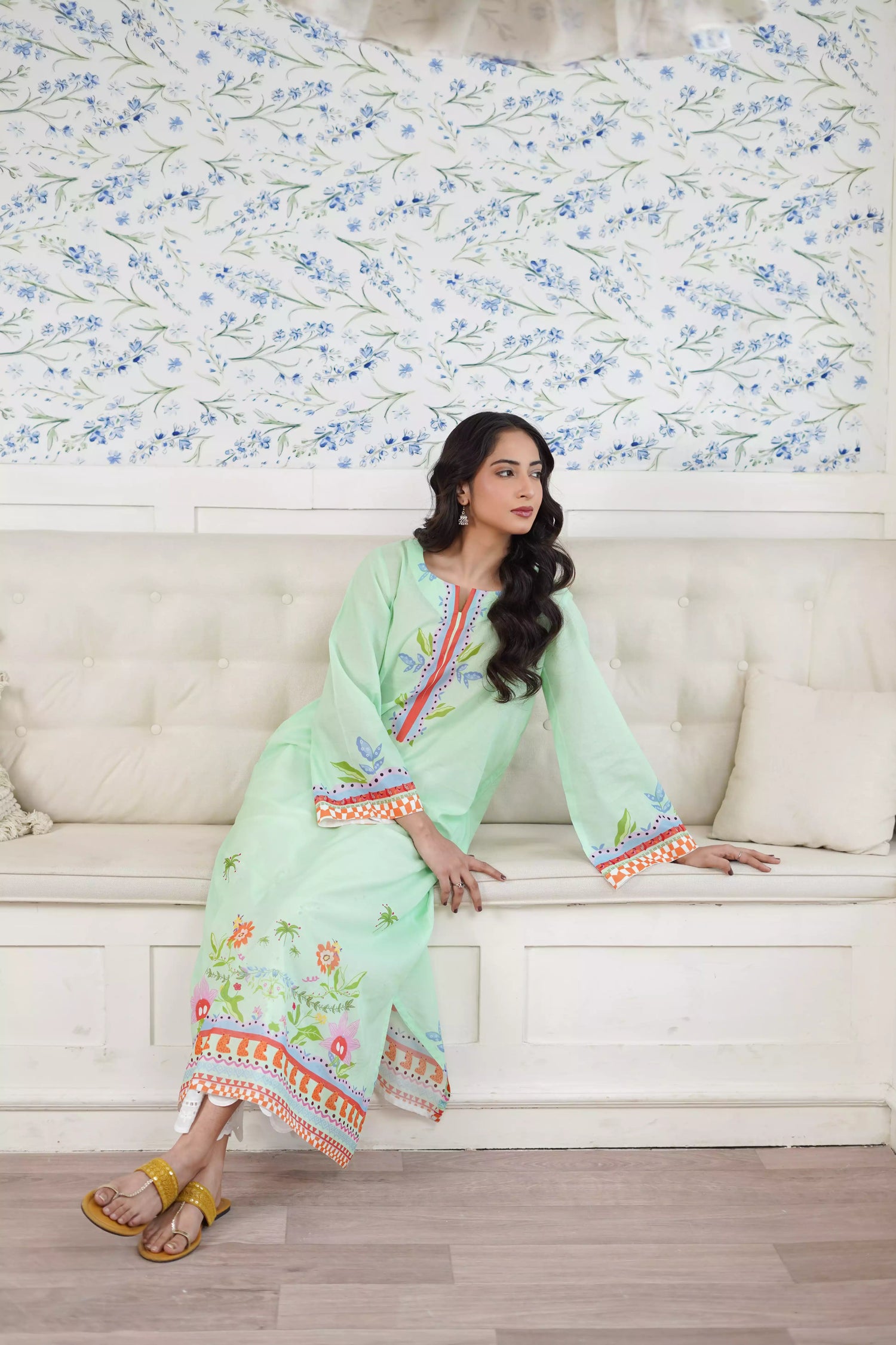 Elegant green kurta suit with beautiful nature inspired print, perfect for adding a touch of sophistication to any outfit.