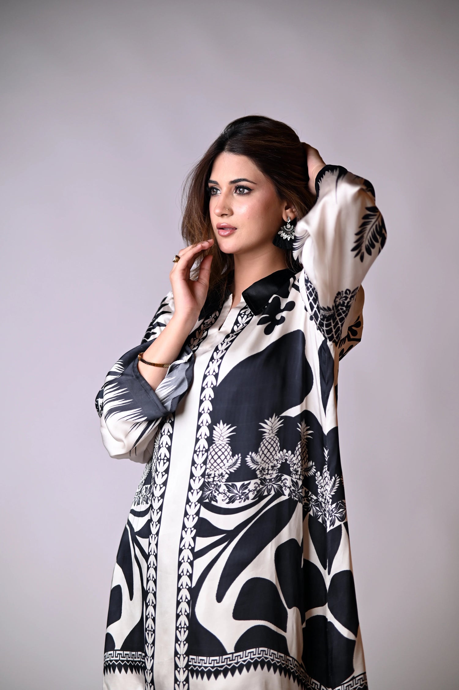 A black and white printed cord set featuring oversized floral and pineapple designs, exuding effortless elegance.