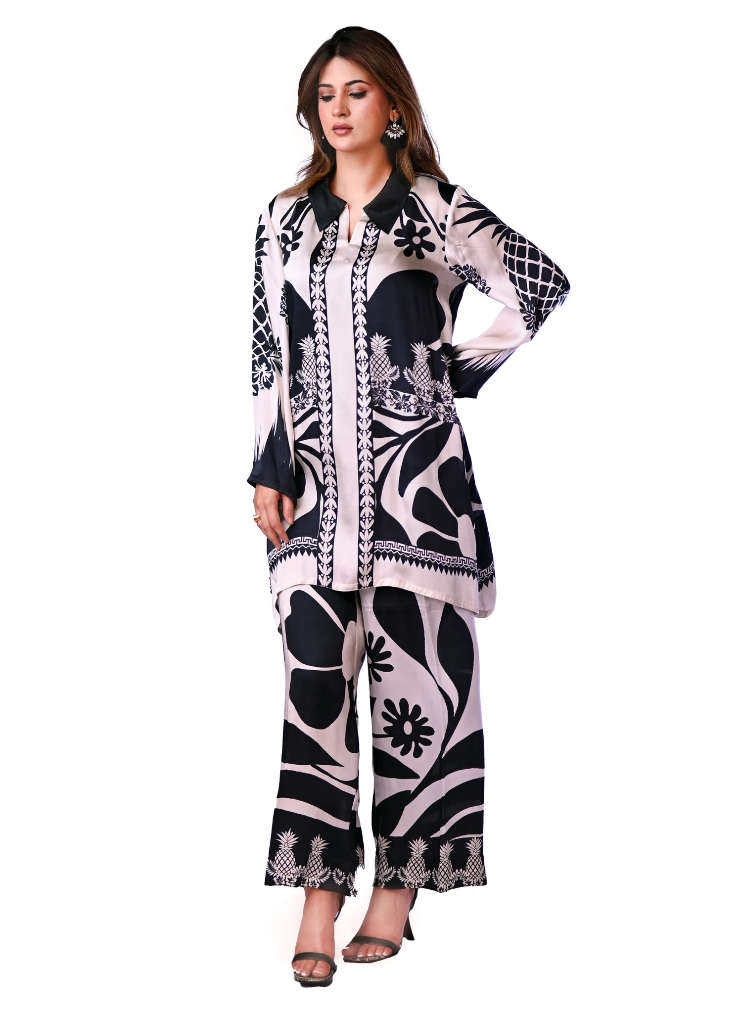 A black and white printed cord set featuring oversized floral and pineapple designs, exuding effortless elegance.