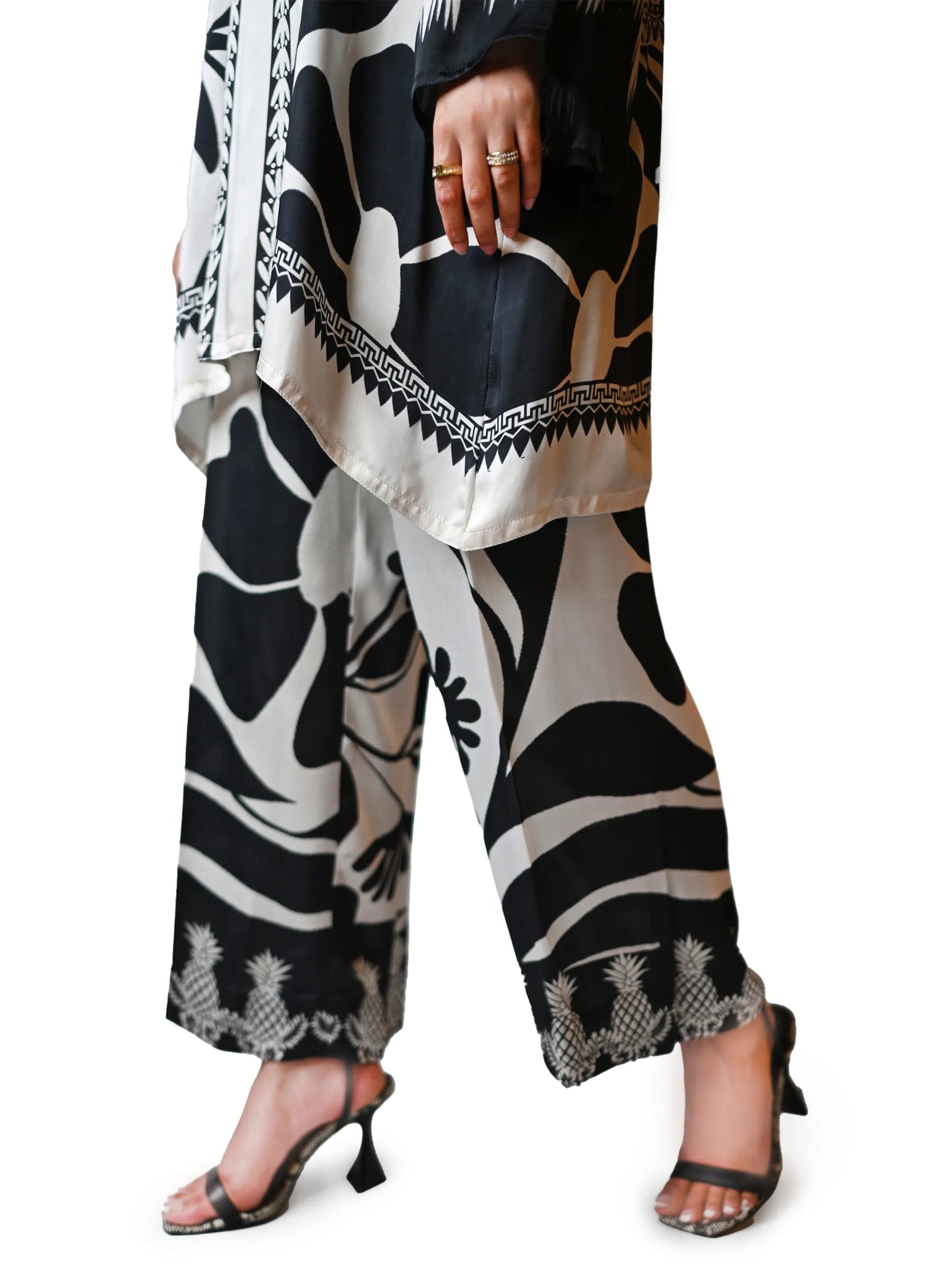 A black and white printed cord set featuring oversized floral and pineapple designs, exuding effortless elegance.