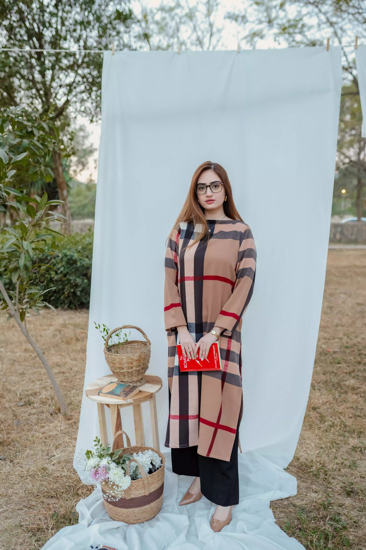 Striped shirt with bold vertical lines, paired with wide flared pants. The outfit blends modern tailoring with a touch of retro style, perfect for casual occasions.
