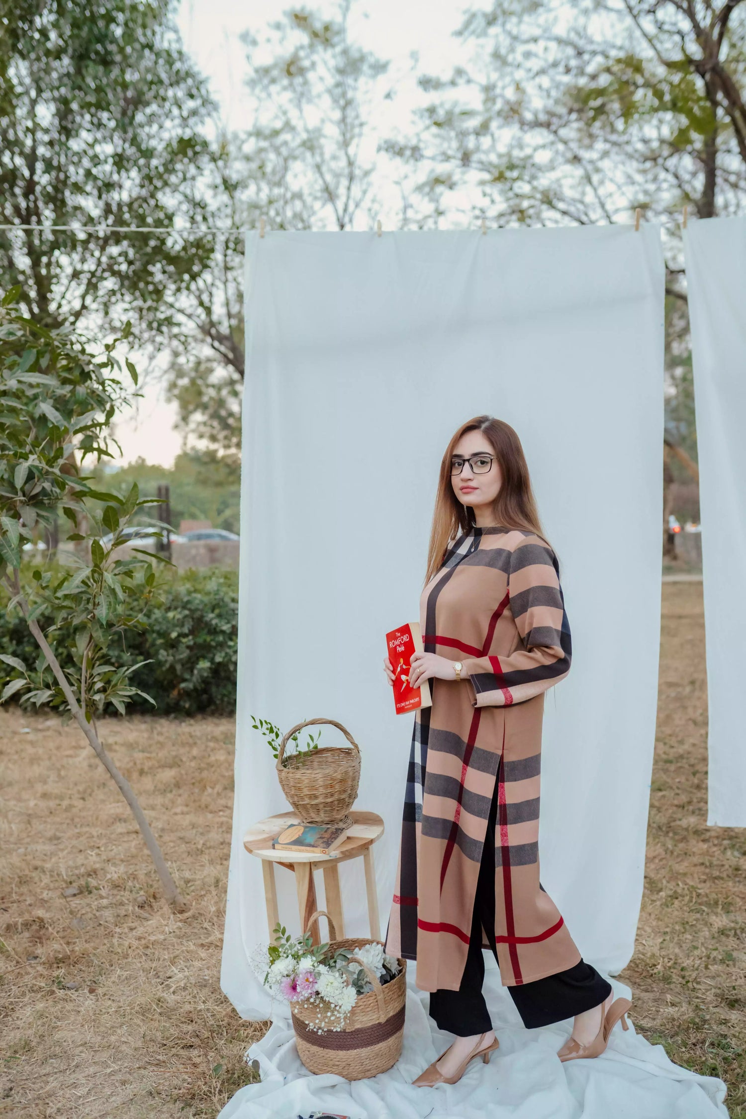 Striped shirt with bold vertical lines, paired with wide flared pants. The outfit blends modern tailoring with a touch of retro style, perfect for casual occasions.