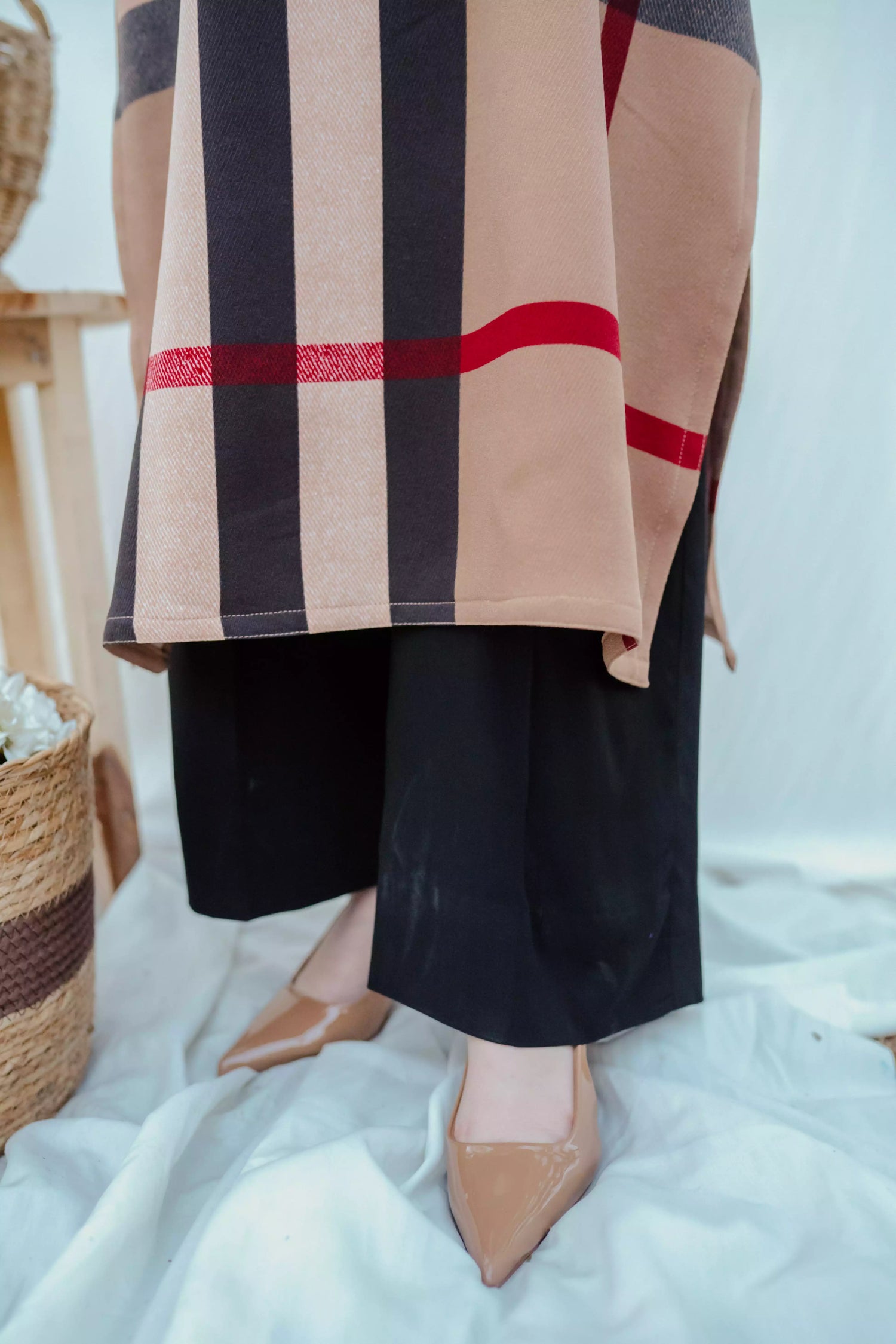 Striped shirt with bold vertical lines, paired with wide flared pants. The outfit blends modern tailoring with a touch of retro style, perfect for casual occasions.