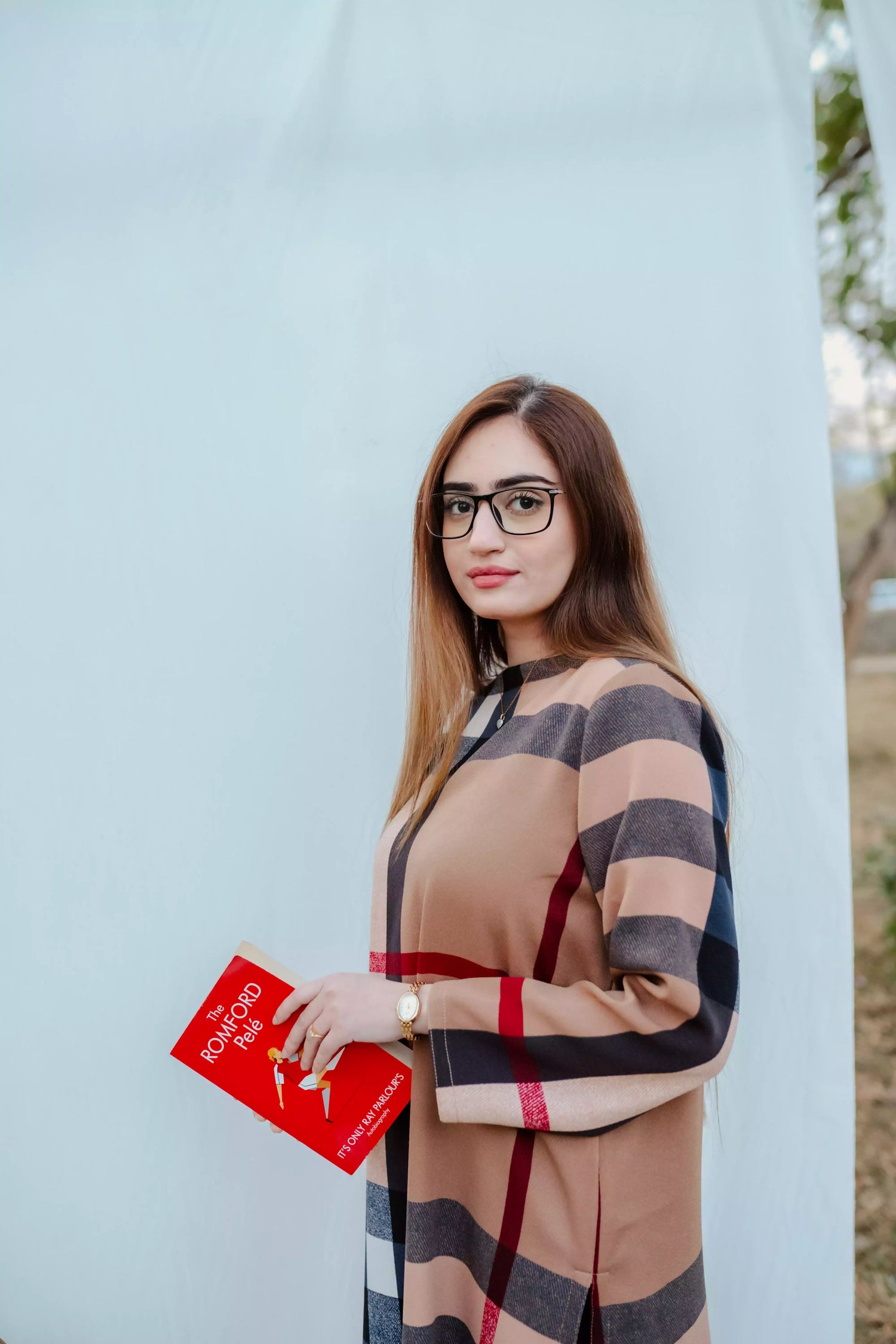 Striped shirt with bold vertical lines, paired with wide flared pants. The outfit blends modern tailoring with a touch of retro style, perfect for casual occasions.