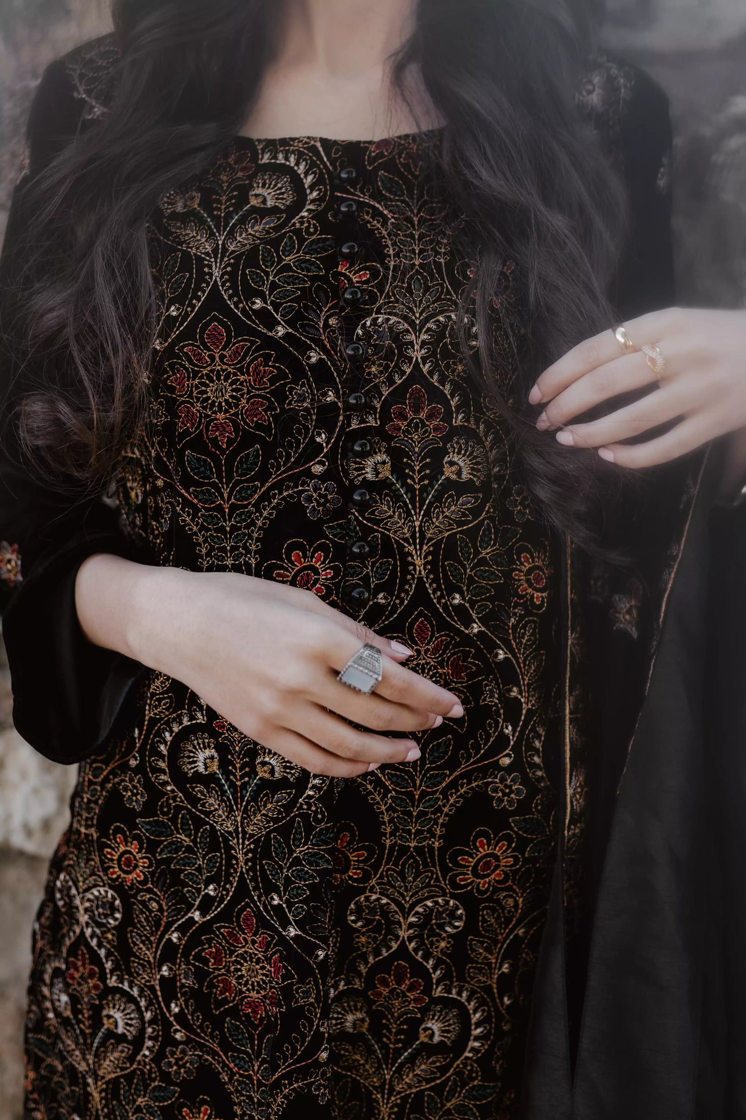 Black velvet suit features intricate multi-thread embroidery on the shirt, paired with plain velvet pants and a matching velvet shawl with embroidered borders for a refined, luxurious look.