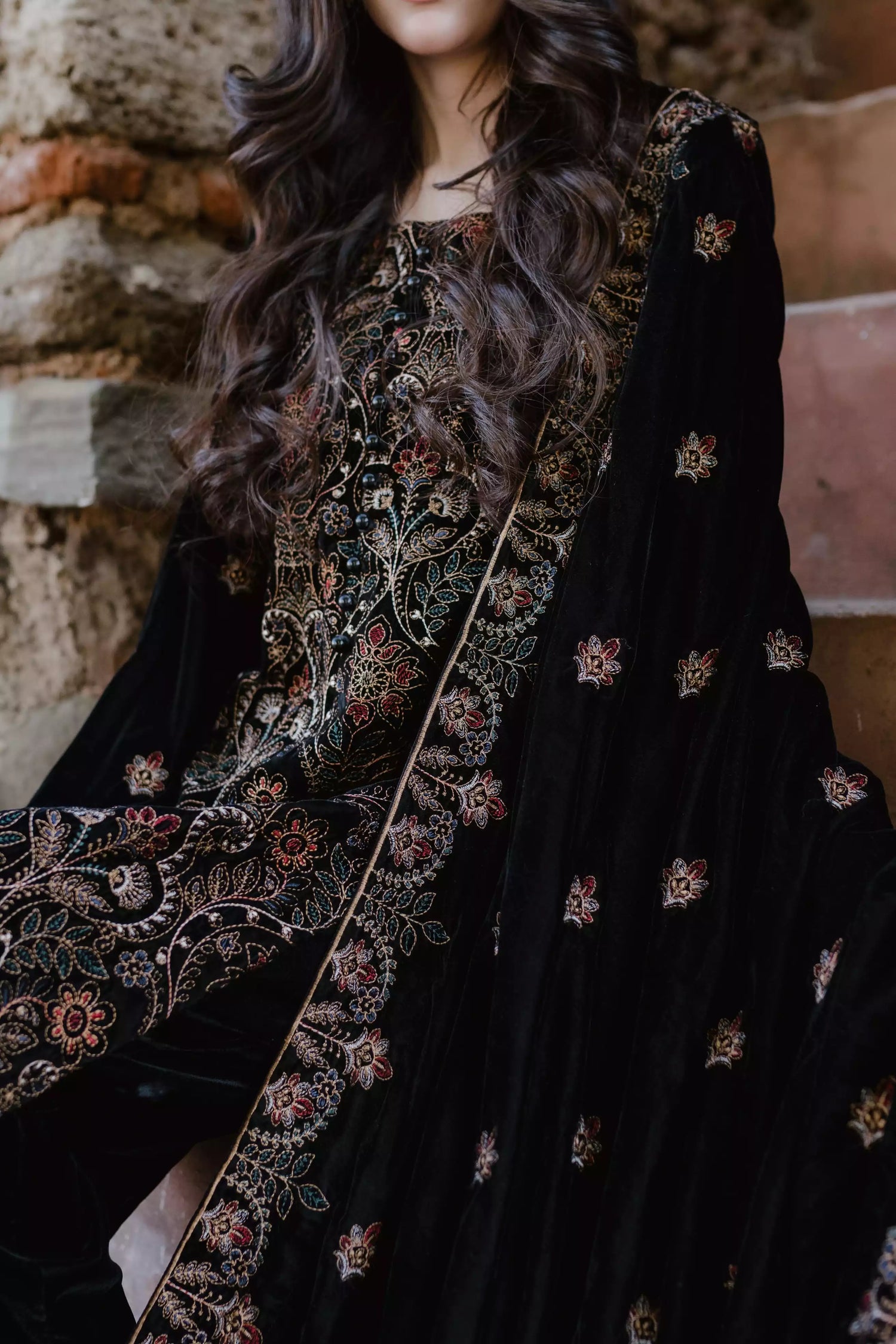 Black velvet suit features intricate multi-thread embroidery on the shirt, paired with plain velvet pants and a matching velvet shawl with embroidered borders for a refined, luxurious look.
