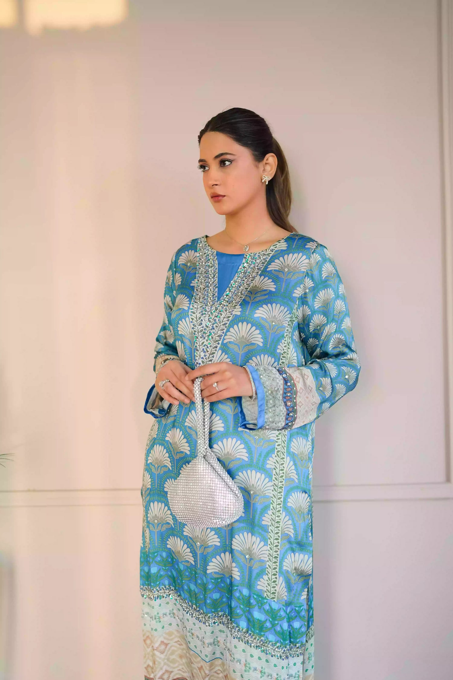Teal-blue silk kurta featuring a shell-inspired geometric digital print, accented with intricate hand-crafted embroidery, offering a elegant silhouette that blends traditional craftsmanship with modern luxury.