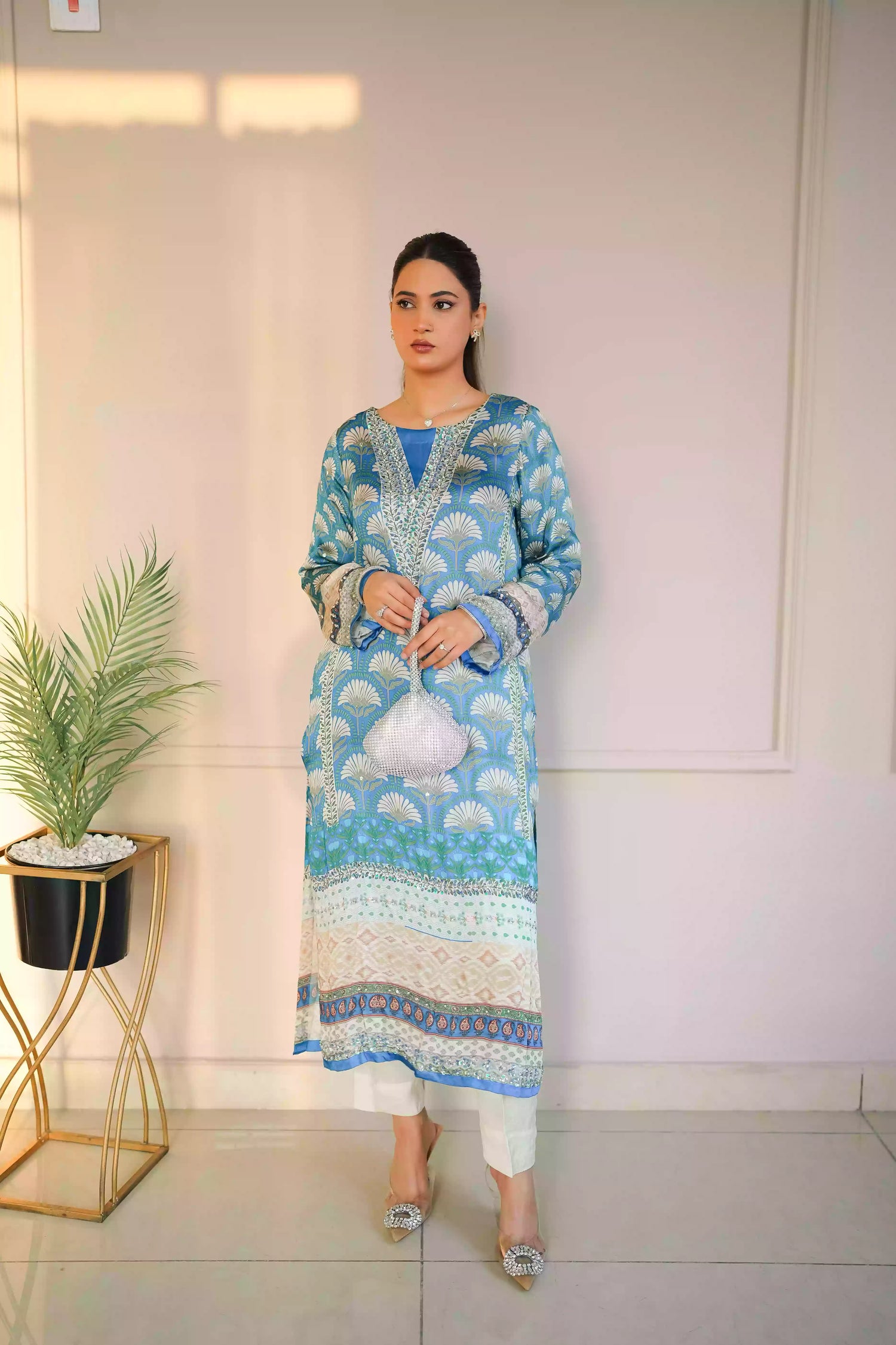 Teal-blue silk kurta featuring a shell-inspired geometric digital print, accented with intricate hand-crafted embroidery, offering a elegant silhouette that blends traditional craftsmanship with modern luxury.