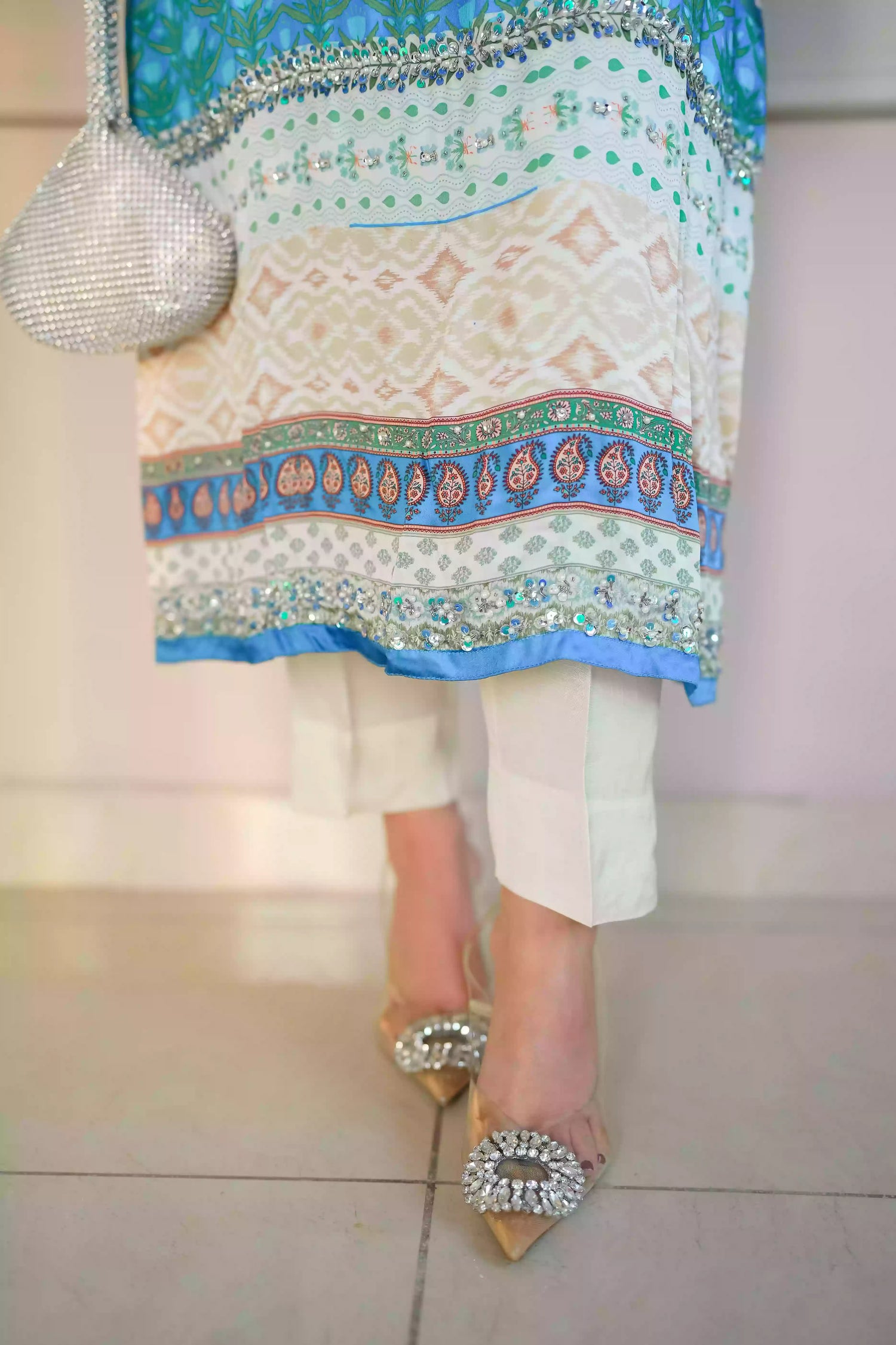 Teal-blue silk kurta featuring a shell-inspired geometric digital print, accented with intricate hand-crafted embroidery, offering a elegant silhouette that blends traditional craftsmanship with modern luxury.