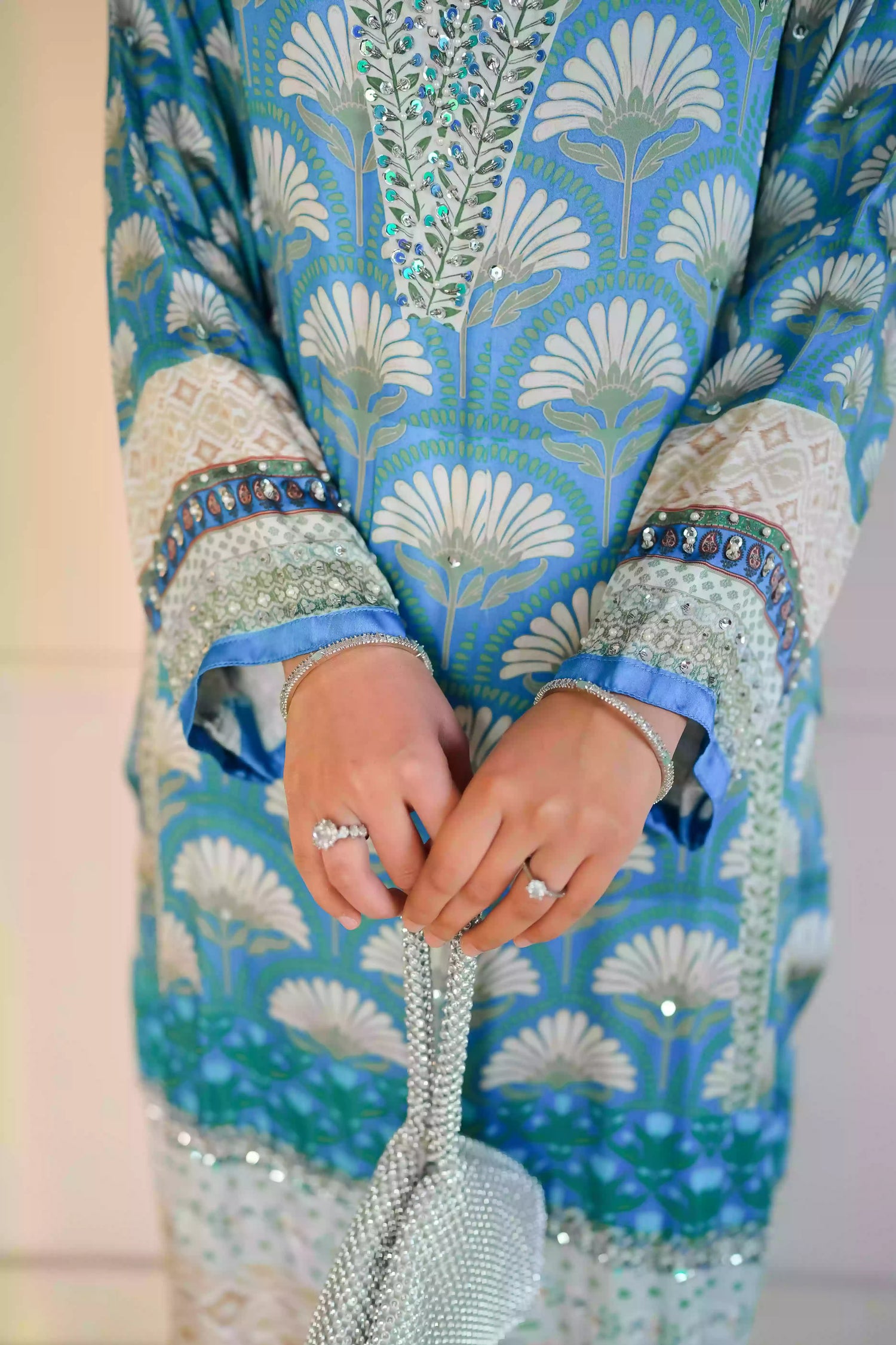 Teal-blue silk kurta featuring a shell-inspired geometric digital print, accented with intricate hand-crafted embroidery, offering a elegant silhouette that blends traditional craftsmanship with modern luxury.