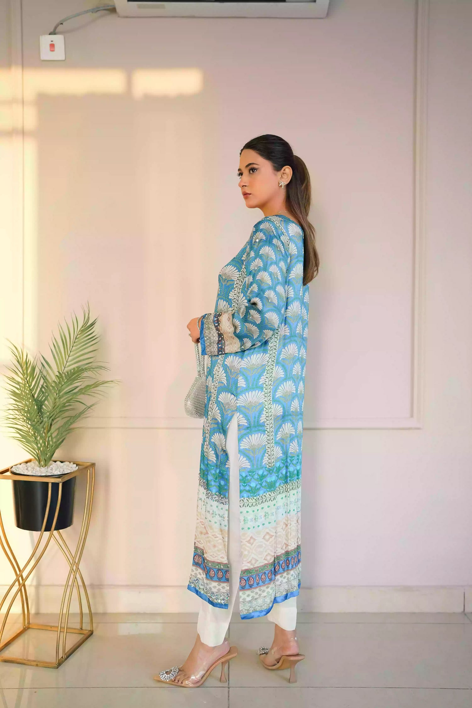 Teal-blue silk kurta featuring a shell-inspired geometric digital print, accented with intricate hand-crafted embroidery, offering a elegant silhouette that blends traditional craftsmanship with modern luxury.
