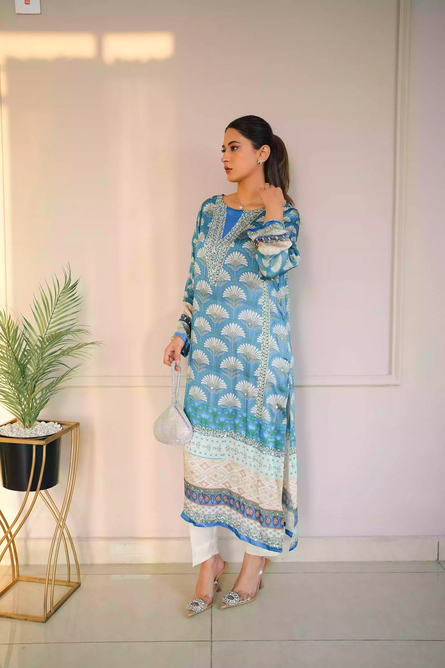 Teal-blue silk kurta featuring a shell-inspired geometric digital print, accented with intricate hand-crafted embroidery, offering a elegant silhouette that blends traditional craftsmanship with modern luxury.