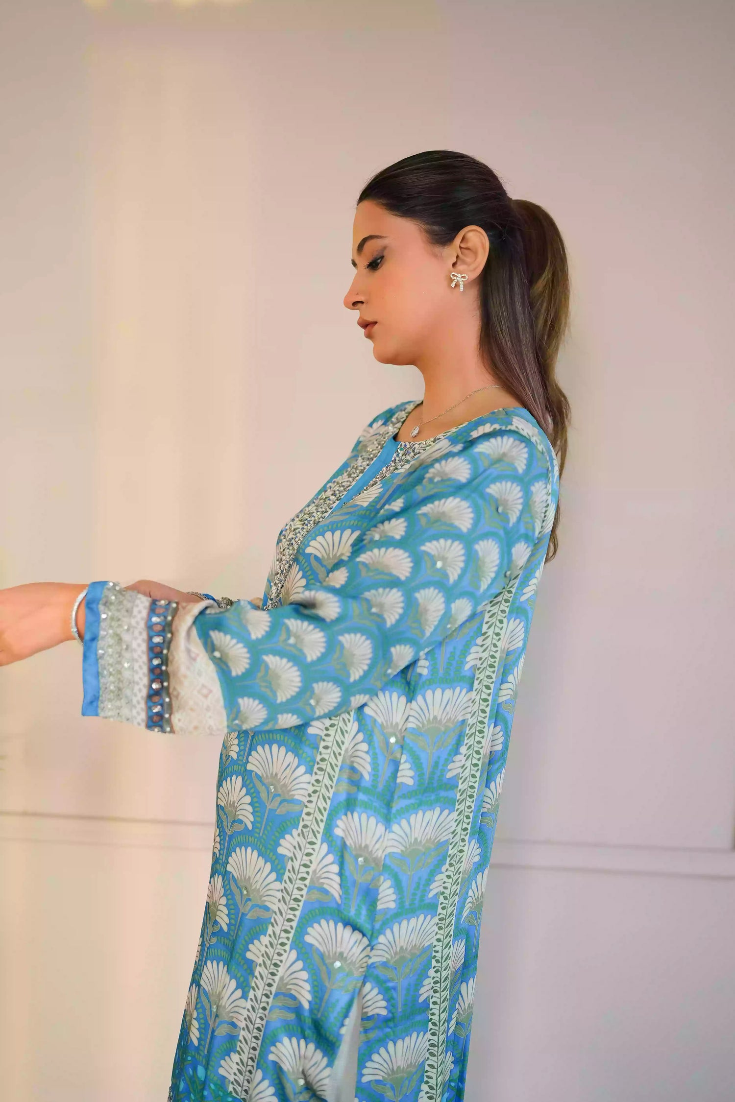 Teal-blue silk kurta featuring a shell-inspired geometric digital print, accented with intricate hand-crafted embroidery, offering a elegant silhouette that blends traditional craftsmanship with modern luxury.
