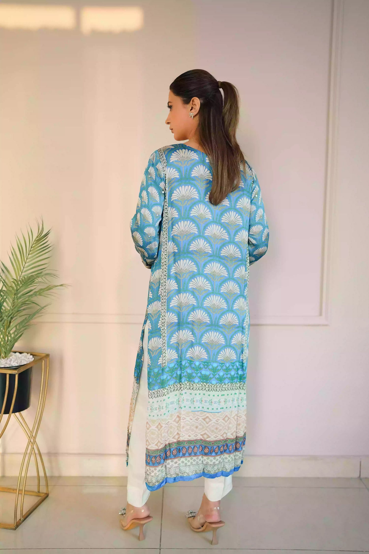 Teal-blue silk kurta featuring a shell-inspired geometric digital print, accented with intricate hand-crafted embroidery, offering a elegant silhouette that blends traditional craftsmanship with modern luxury.
