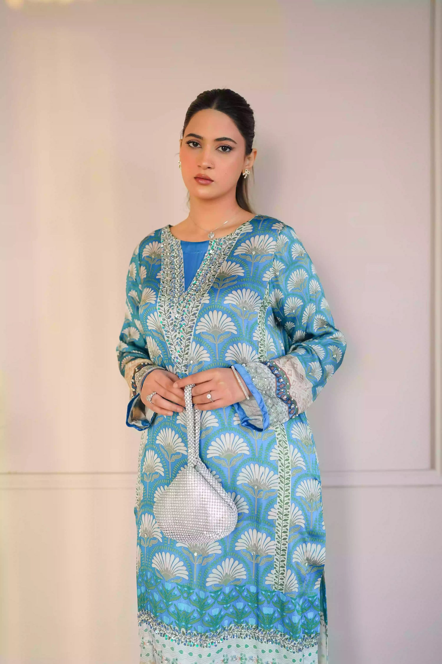 Teal-blue silk kurta featuring a shell-inspired geometric digital print, accented with intricate hand-crafted embroidery, offering a elegant silhouette that blends traditional craftsmanship with modern luxury.