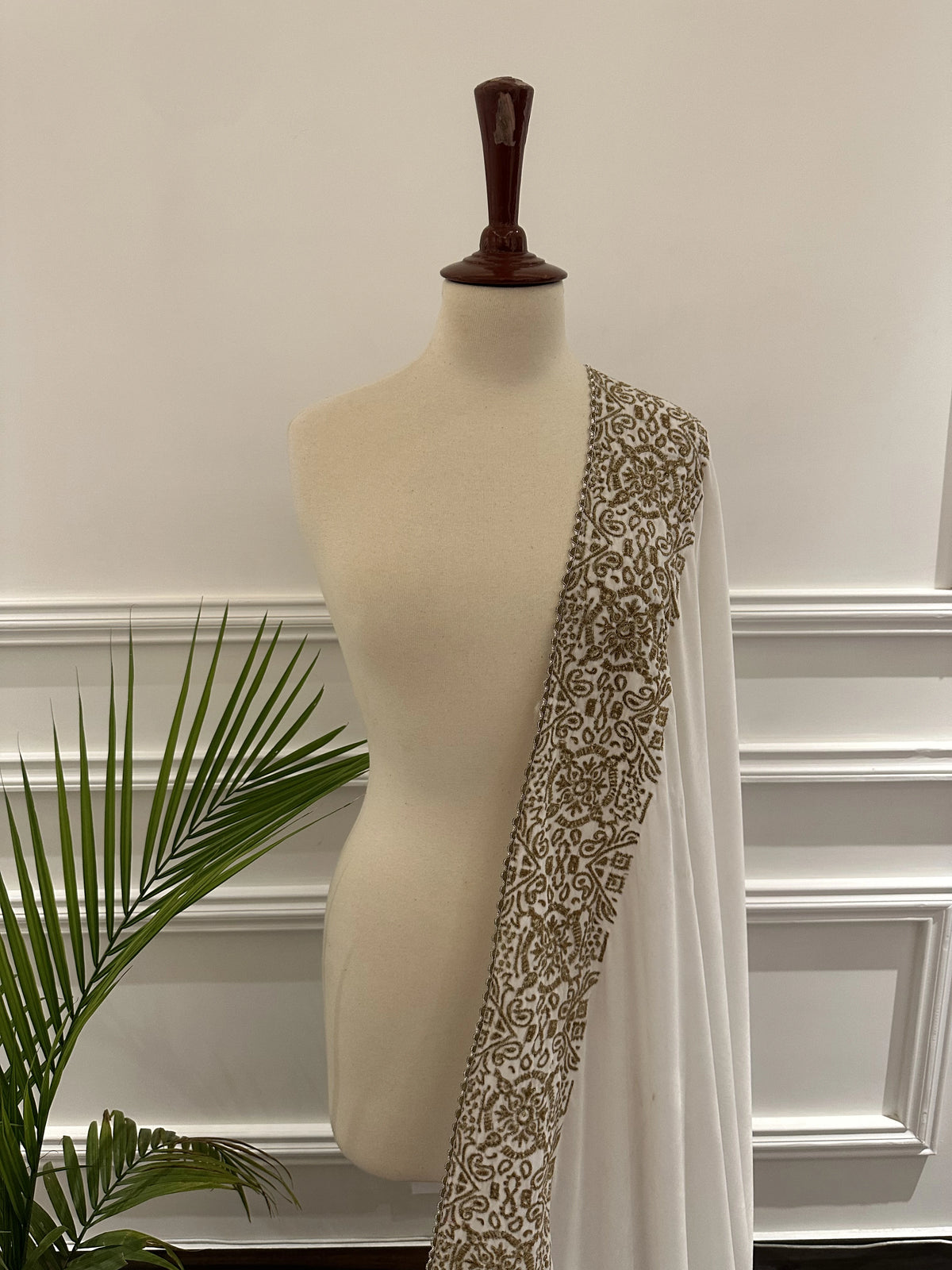 Velvet Shawl featuring a geometric border with intricate gold tilla embroidery. Ideal for Eid, or festive celebrations and heritage charm with modern elegance.