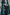 Emerald green velvet suit with cream thread embroidery, paired with an embroidered shawl and plain velvet pants for an elegant, luxurious look.