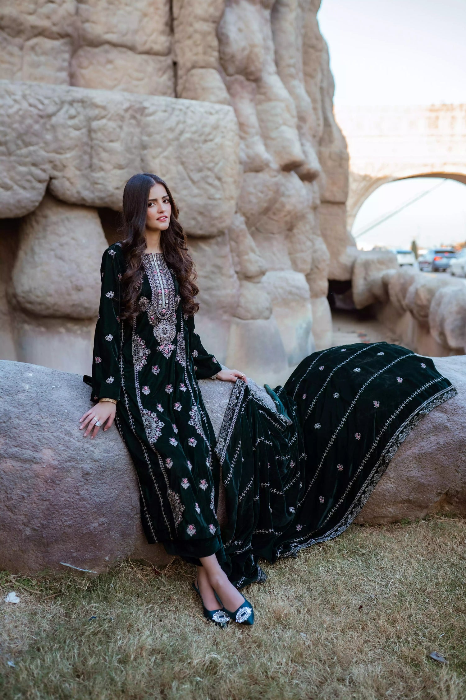 Emerald green velvet suit with cream thread embroidery, paired with an embroidered shawl and plain velvet pants for an elegant, luxurious look.