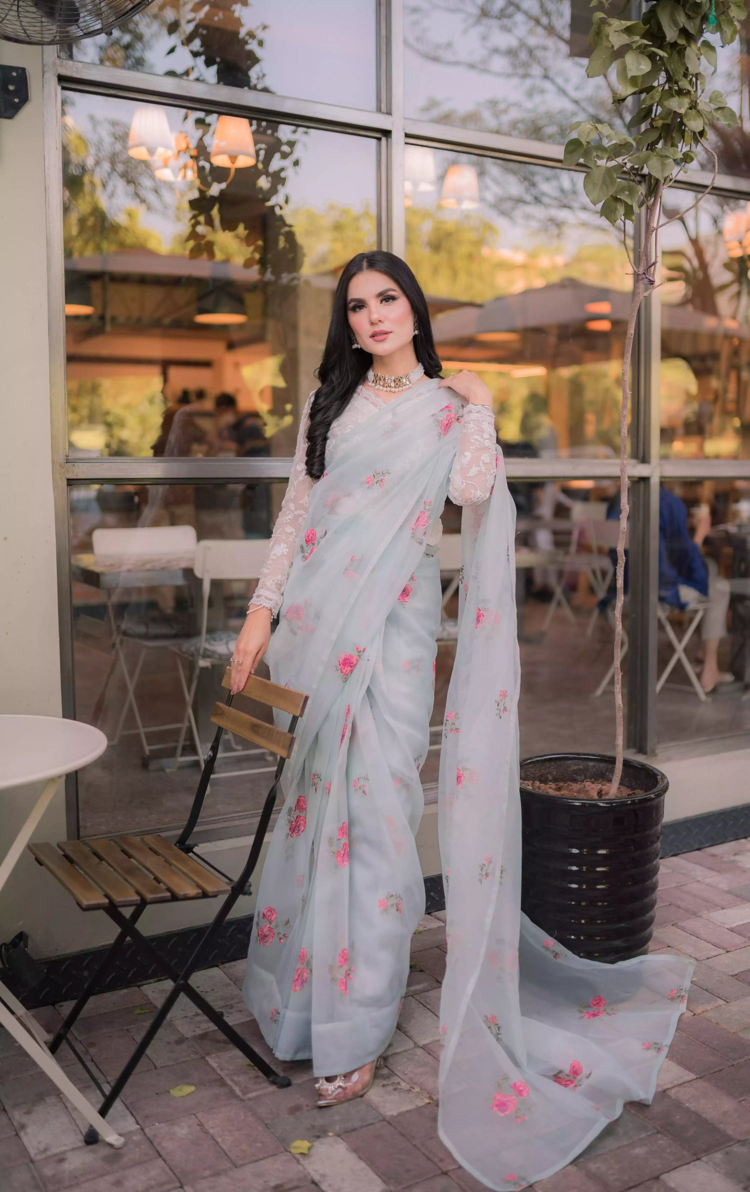 The serene ice blue saree with elegant drape with delicate intricate floral details.