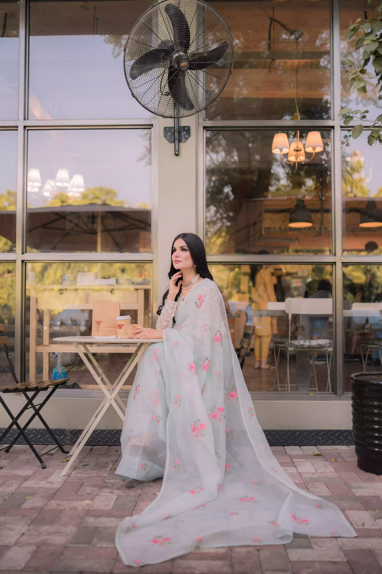 The serene ice blue saree with elegant drape with delicate intricate floral details.