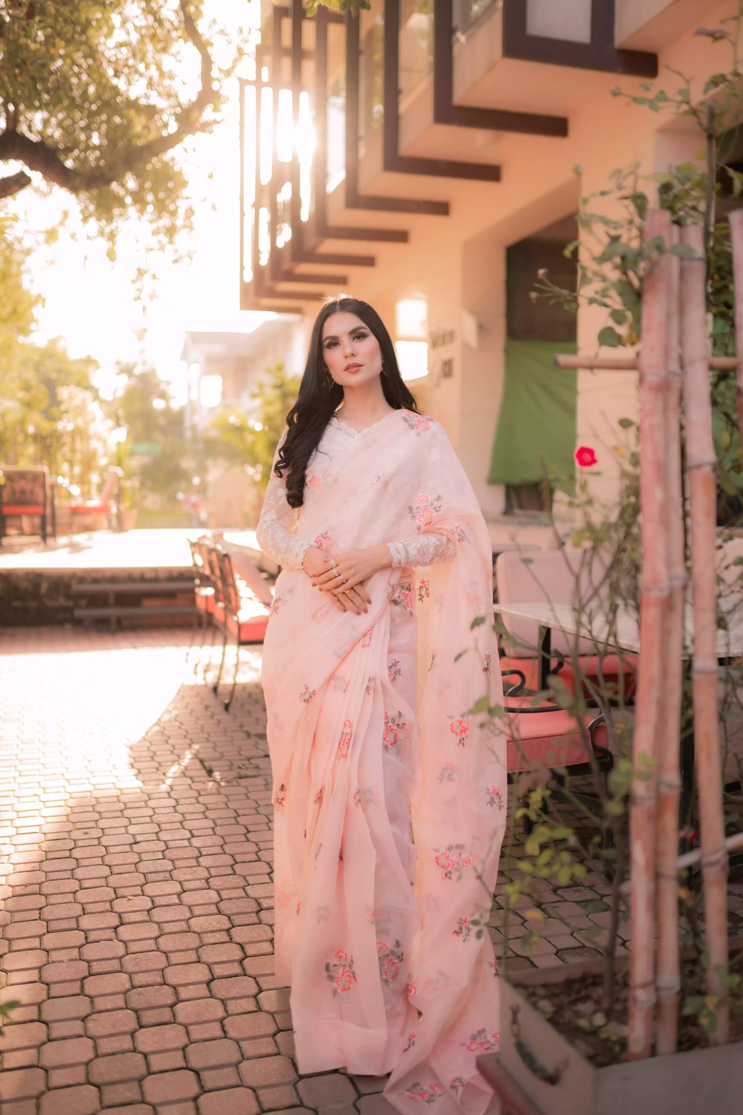 Powder pink embroidered cotton net saree with floral motifs, shown with optional stitched chiffon blouse and matching inner, perfect for weddings and formal occasions.